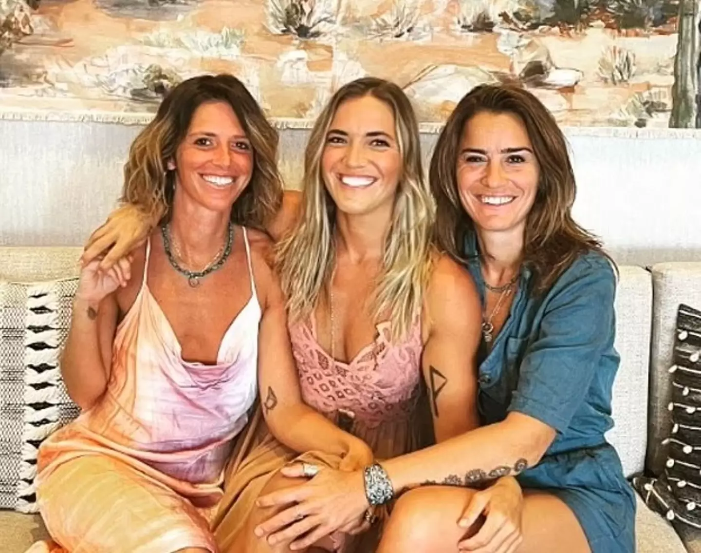 Dr Nicole (right) with her wife Lolly (left) and their partner Jenna (centre).