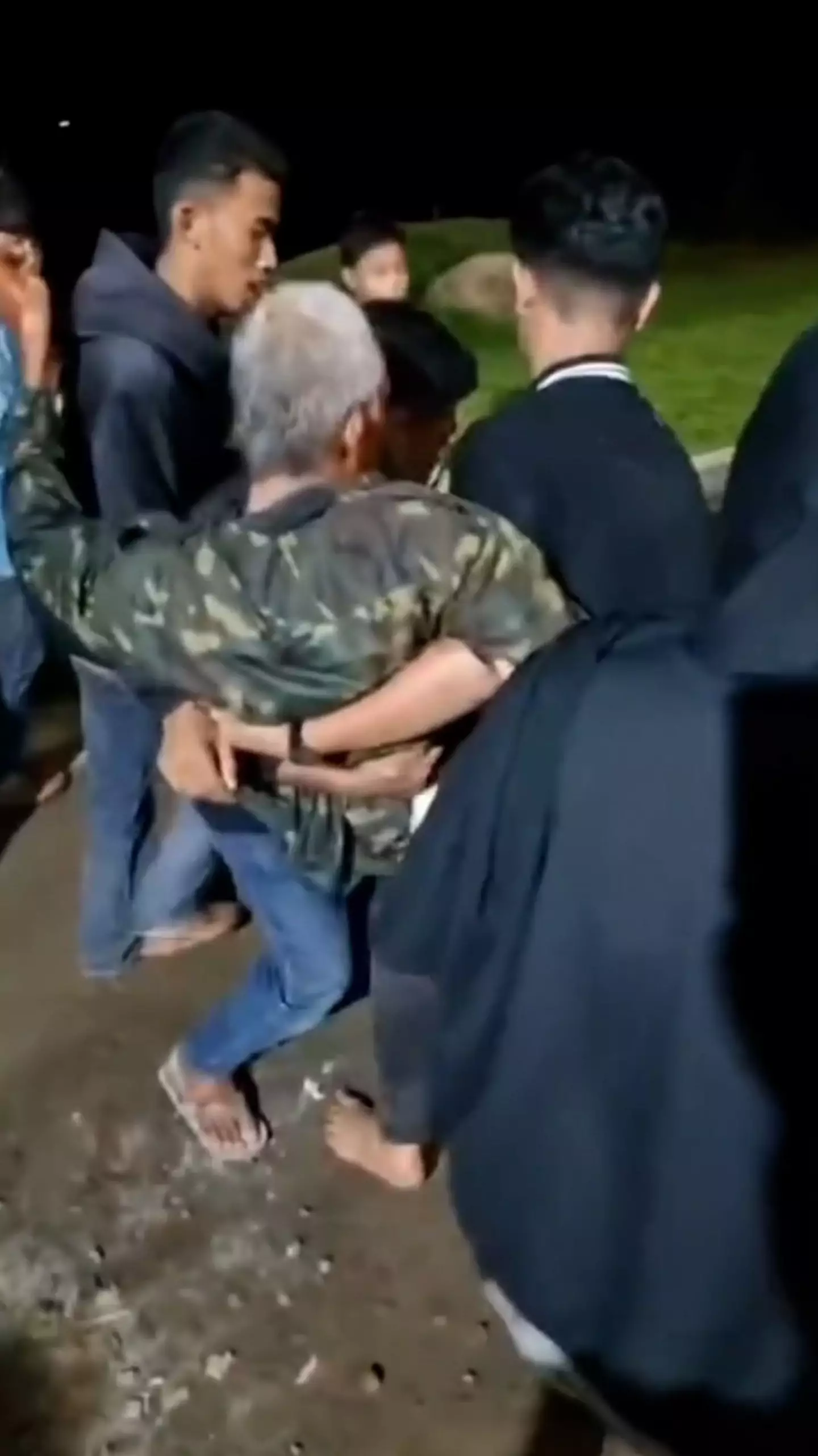 The man could be seen being carried away after the attack (Viral Press)