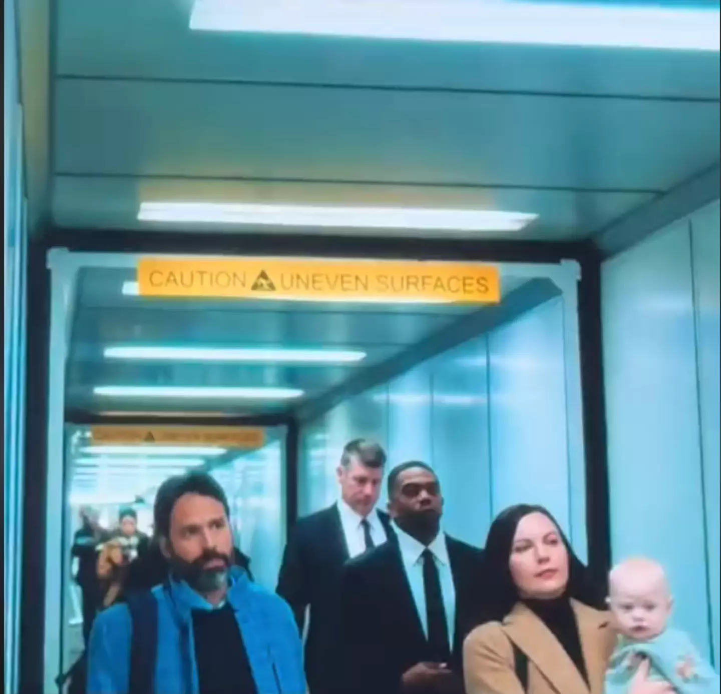 And here is the same actor holding a different child just seconds later (Netflix)