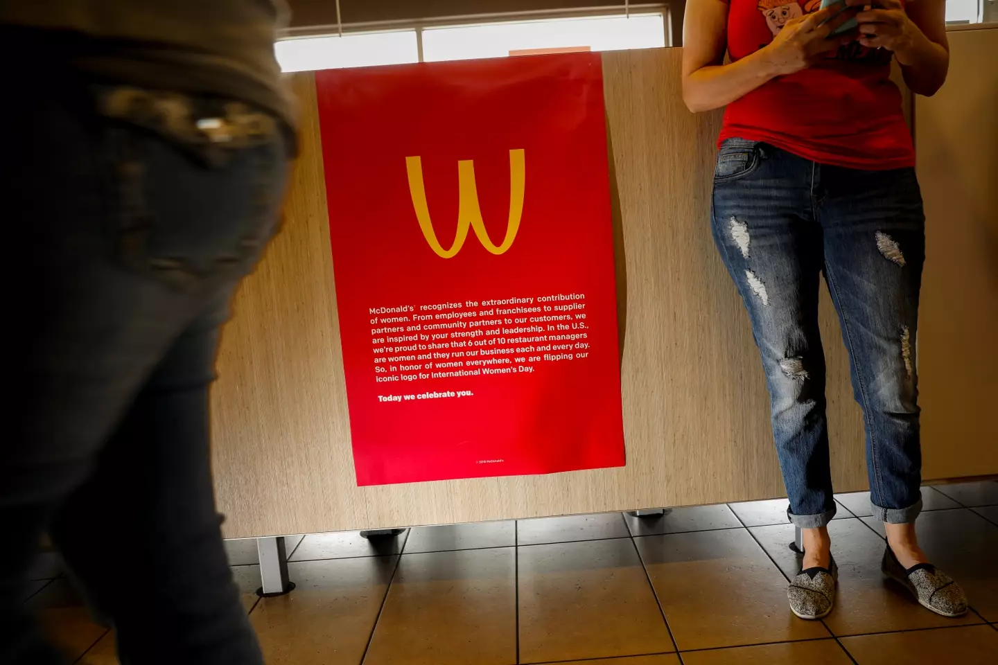 A poster explaining the M becoming a W (Jay L. Clendenin/Los Angeles Times via Getty Images)