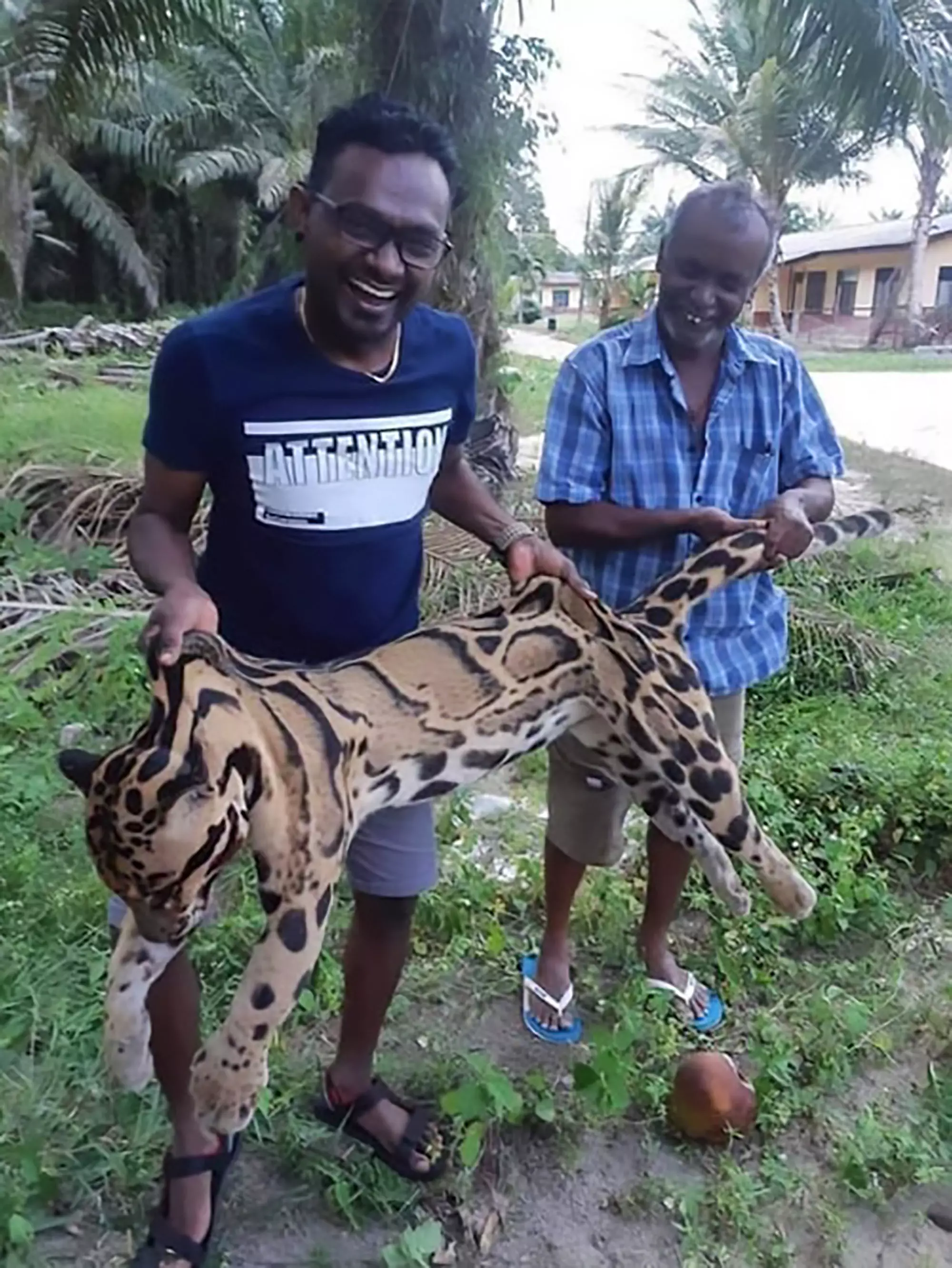 The suspected poachers with the leopard.