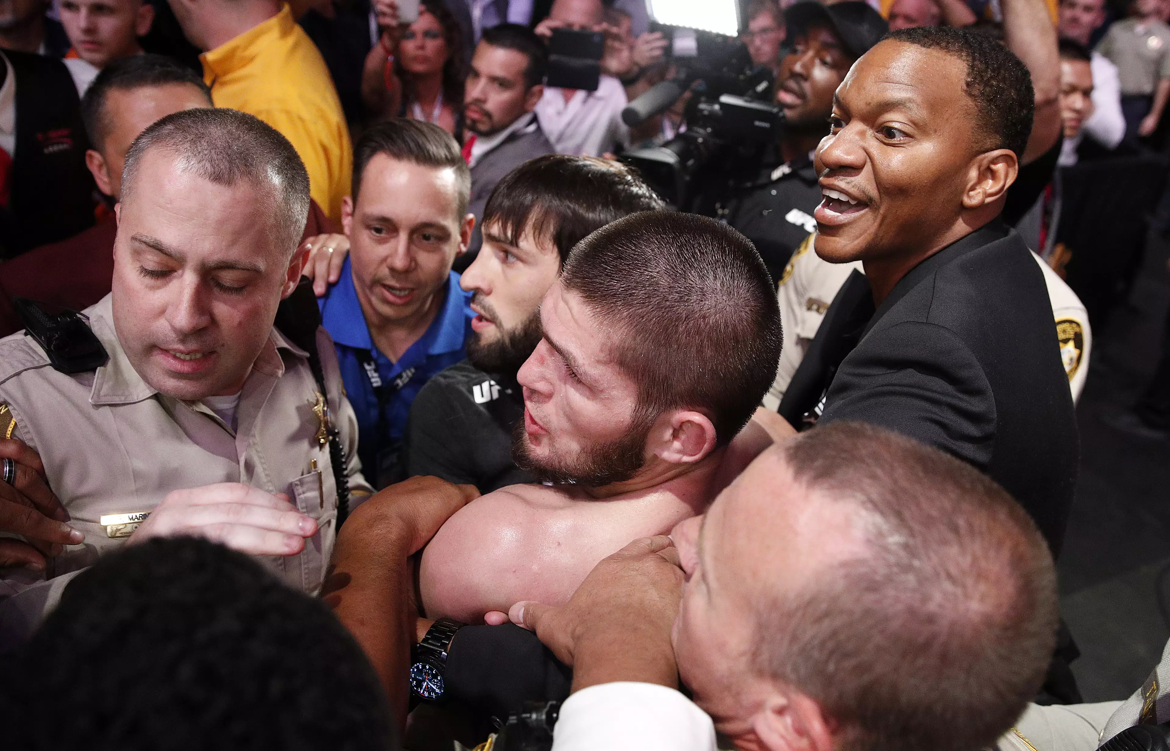 Security hold back Khabib after the incident. Image: PA Images