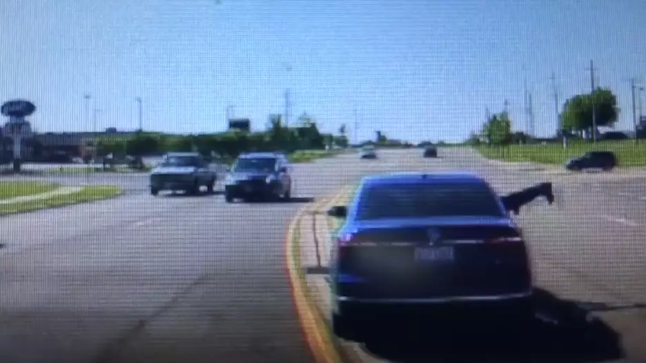 Man Heroically Jumps Headfirst Into Moving Car To Save Driver Having A Seizure