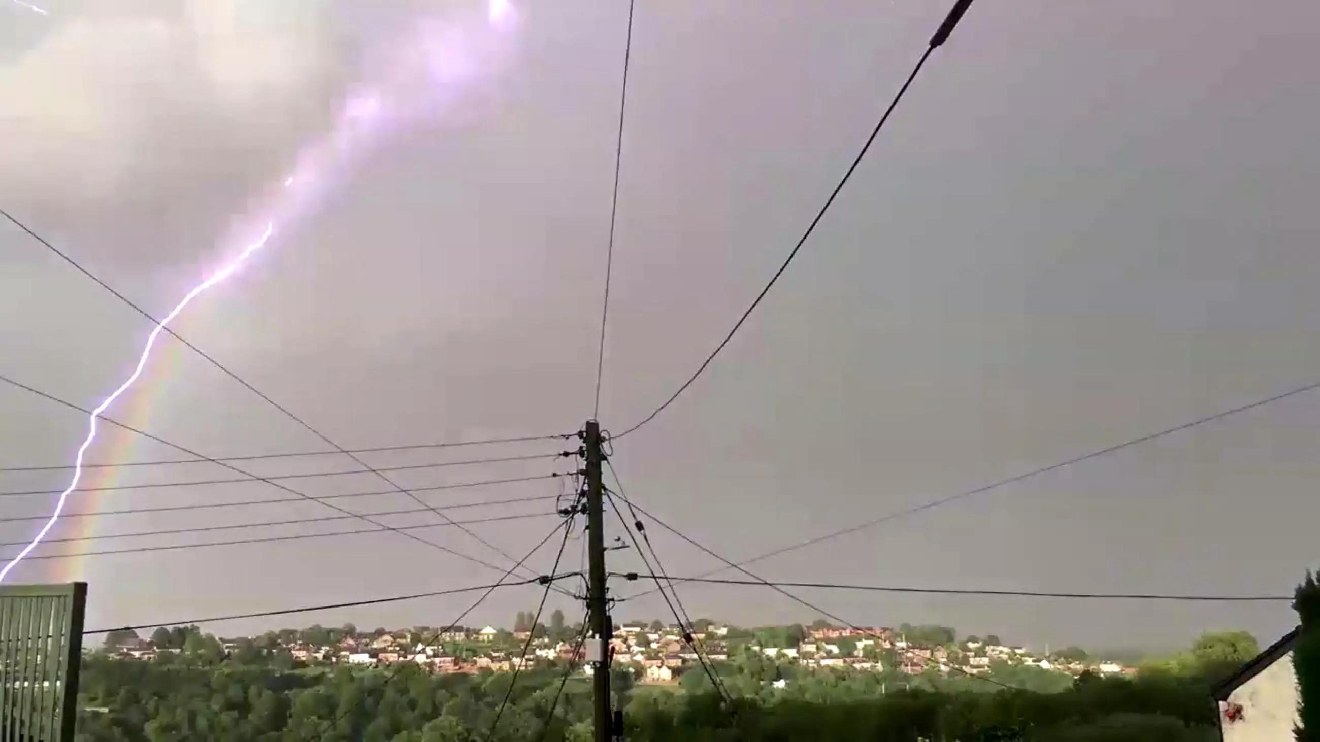 Remarkable 'One In A Million' Moment Bolt Of Lightning Strikes Curvature Of Rainbow