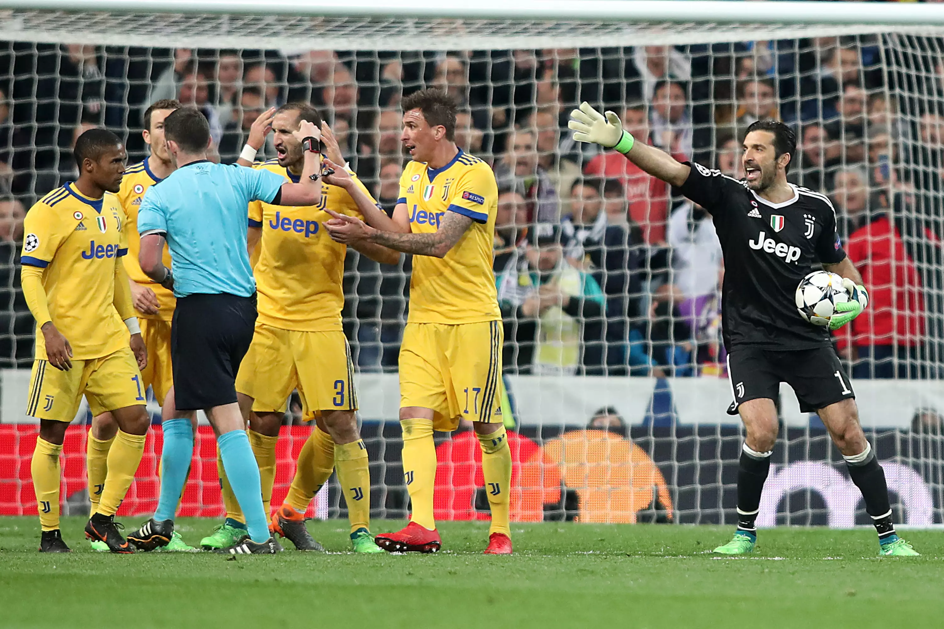 Buffon reacts to Oliver awarding a penalty. Image: PA