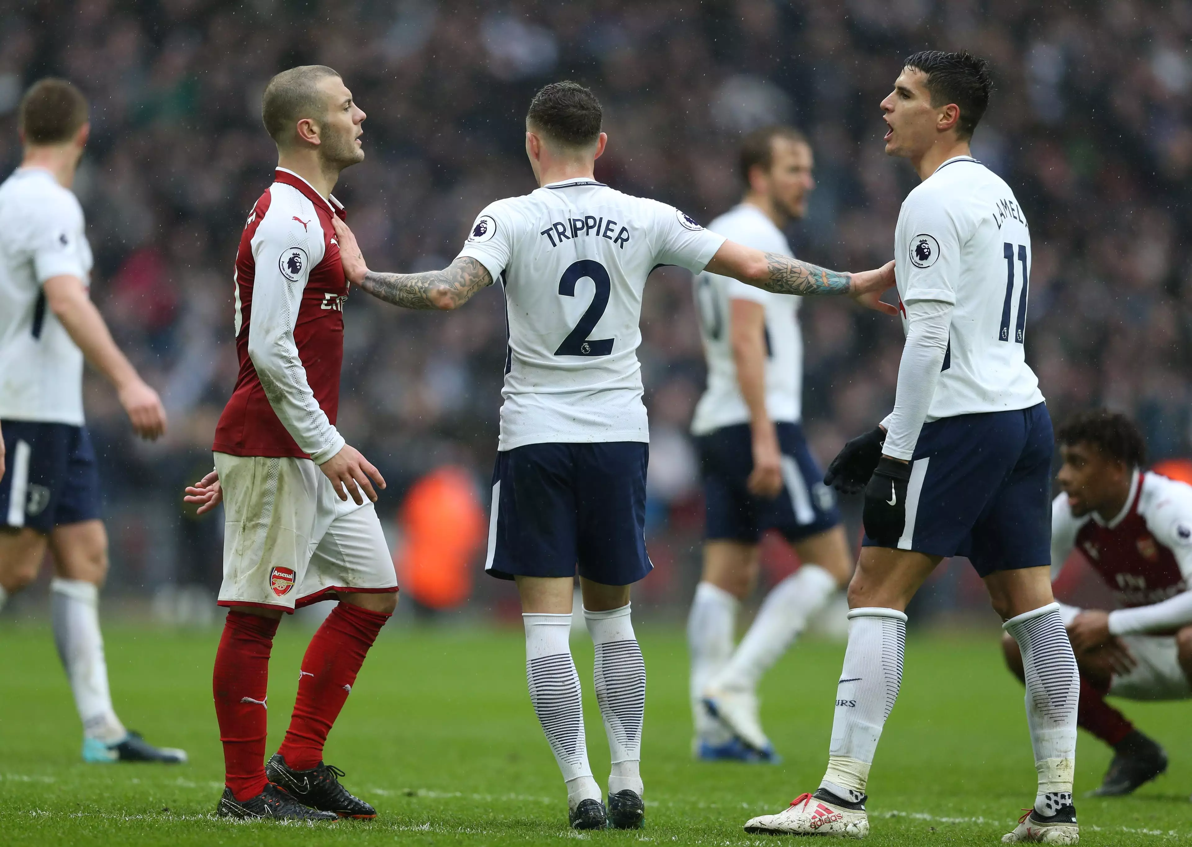 Wilshere and Lamela confront each other. Image: PA