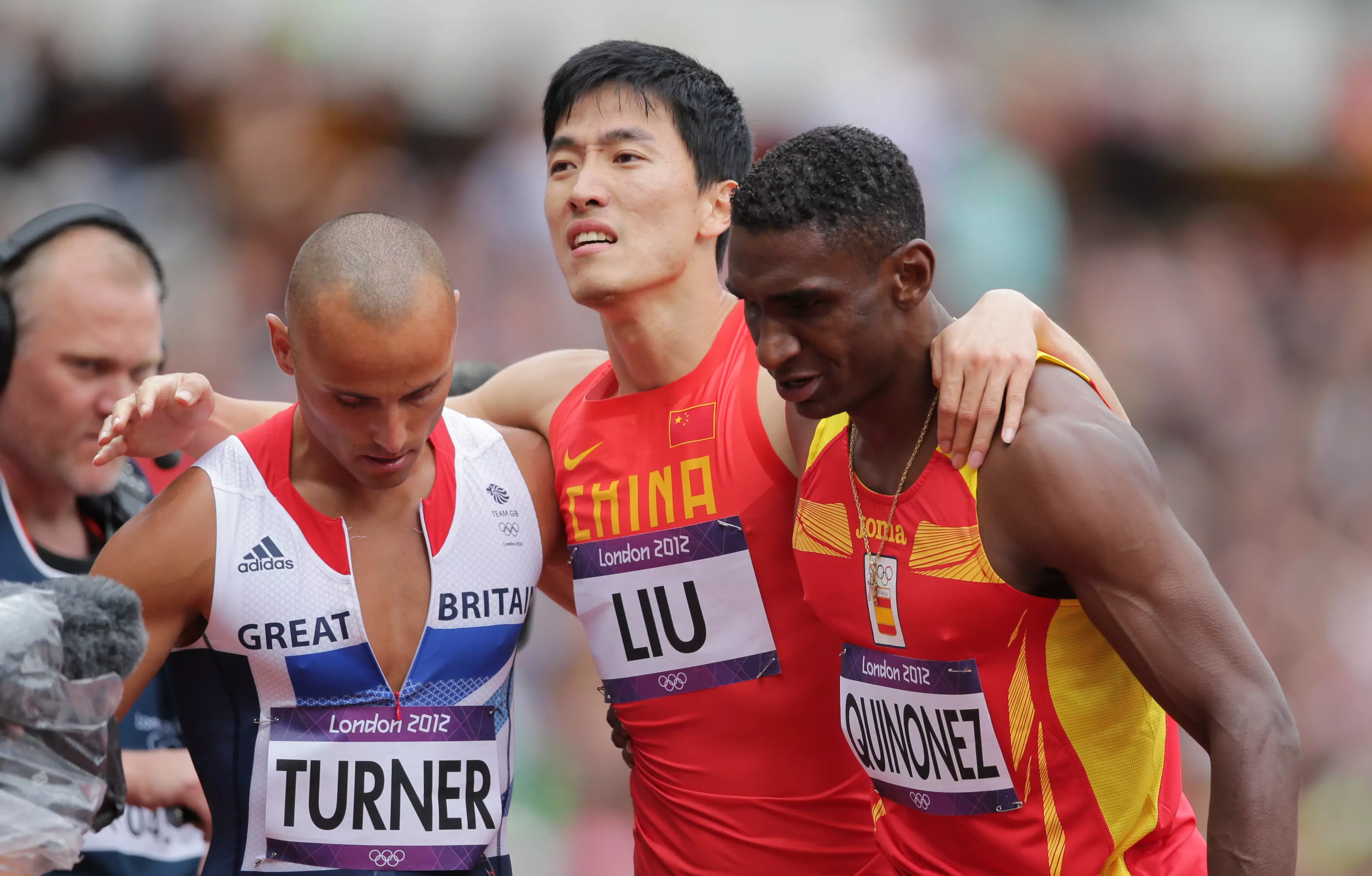 Xiang Liu was escorted from the track by his rival competitors.