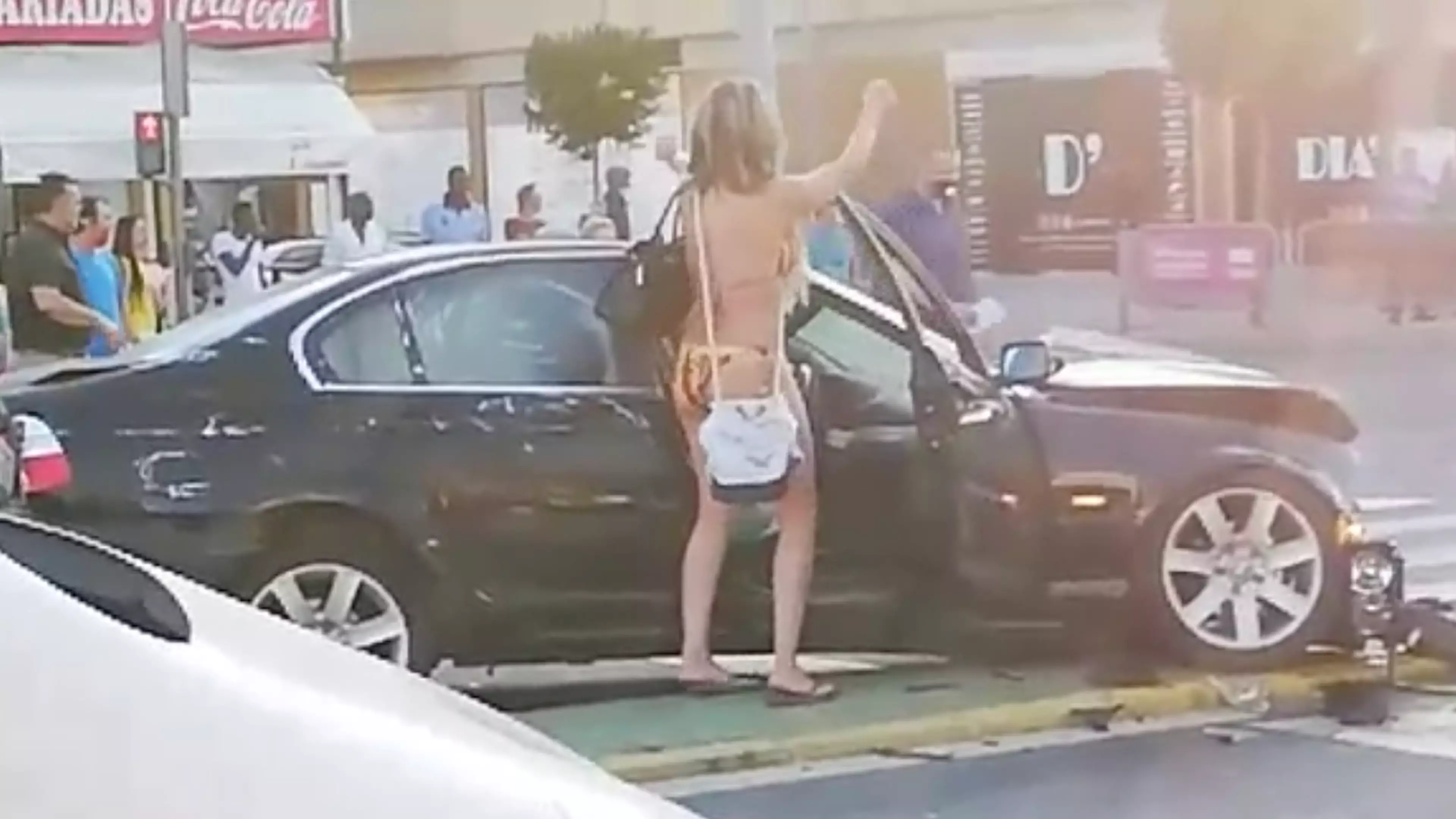 Bikini-Clad Woman Filmed Dancing Around Car After Crashing It