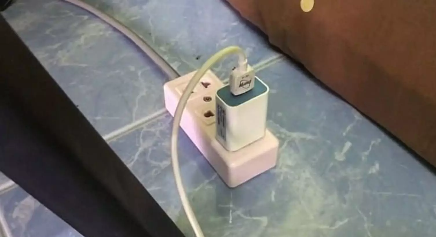 The phone was plugged into a charging point with a cheap charger.
