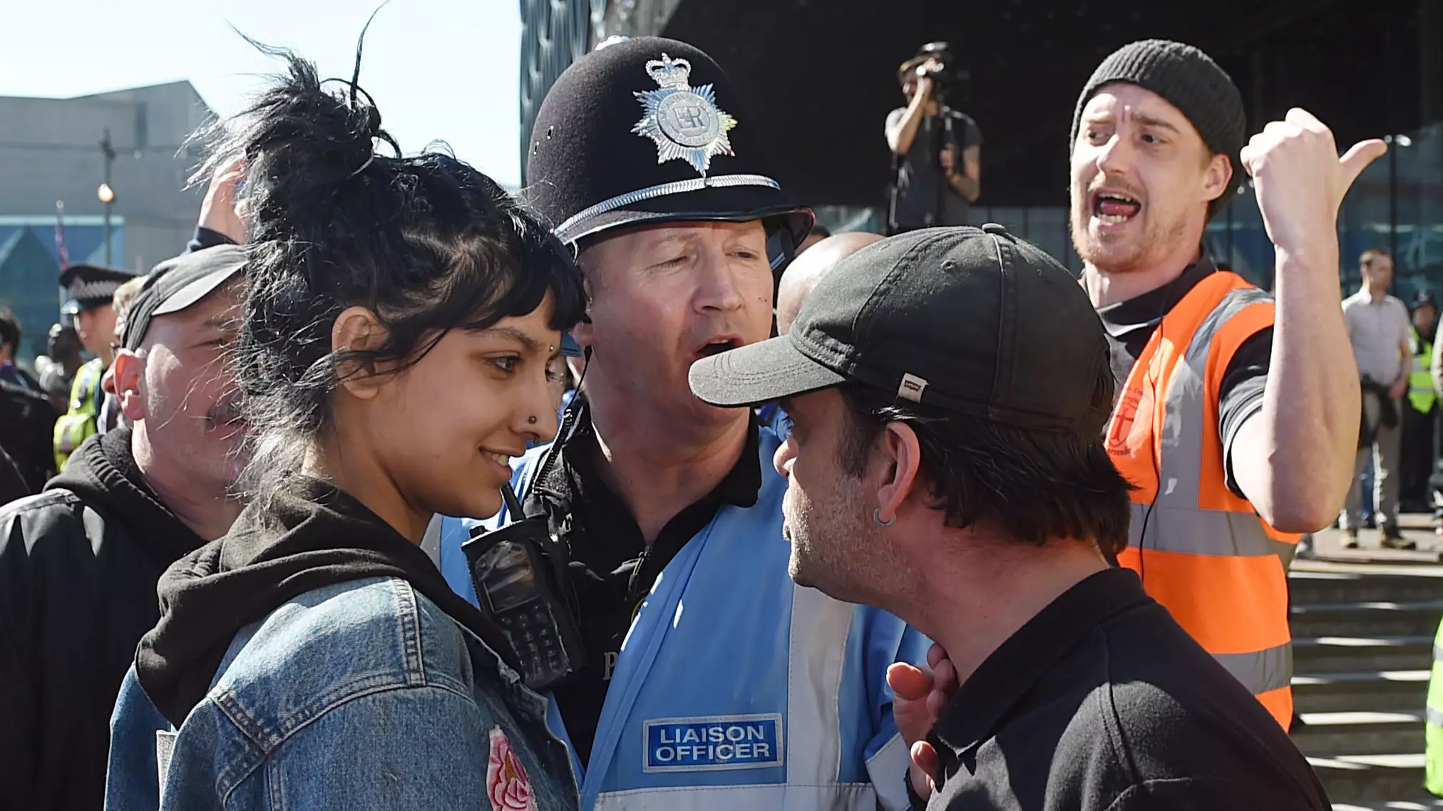 Incredible Picture Of 'Contemptuous' Woman Smiling At EDL Protester Goes Viral