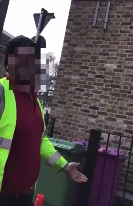 The workmen were confronted by a 5G conspiracy theorist while working in London.