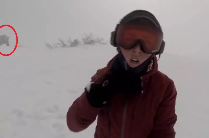 WATCH: Snowboarder Doesn't Realise She's Being Chased By A Massive Bear