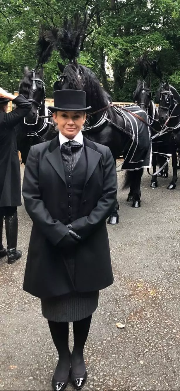 Robyn dressed for her job as a funeral director.