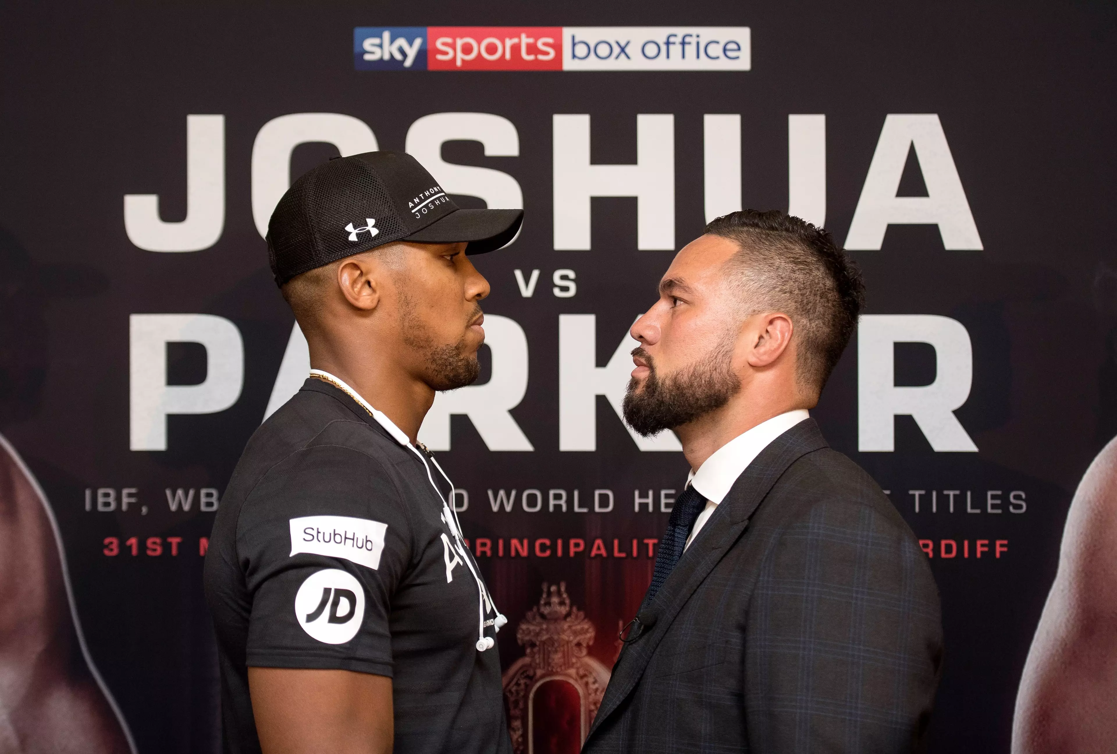 Joshua and Parker face-off at the pre-fight presser. Image: PA