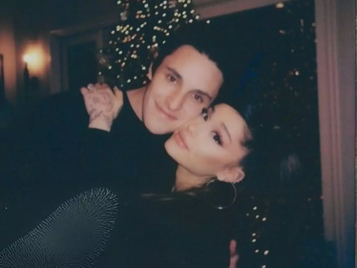 Dalton Gomez and Ariana Grande cuddling up at Christmas '