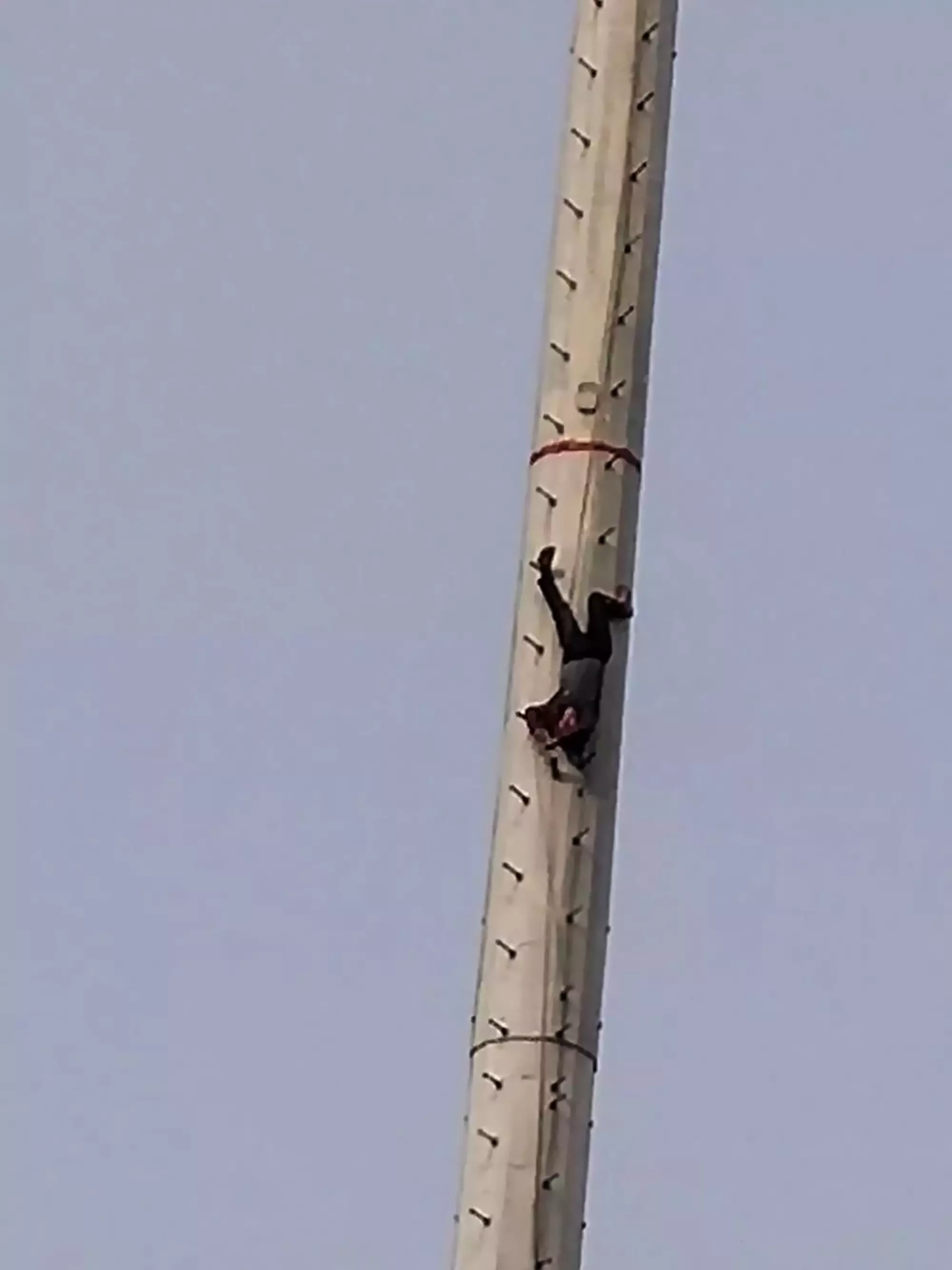 The man can be seen hanging upside down.