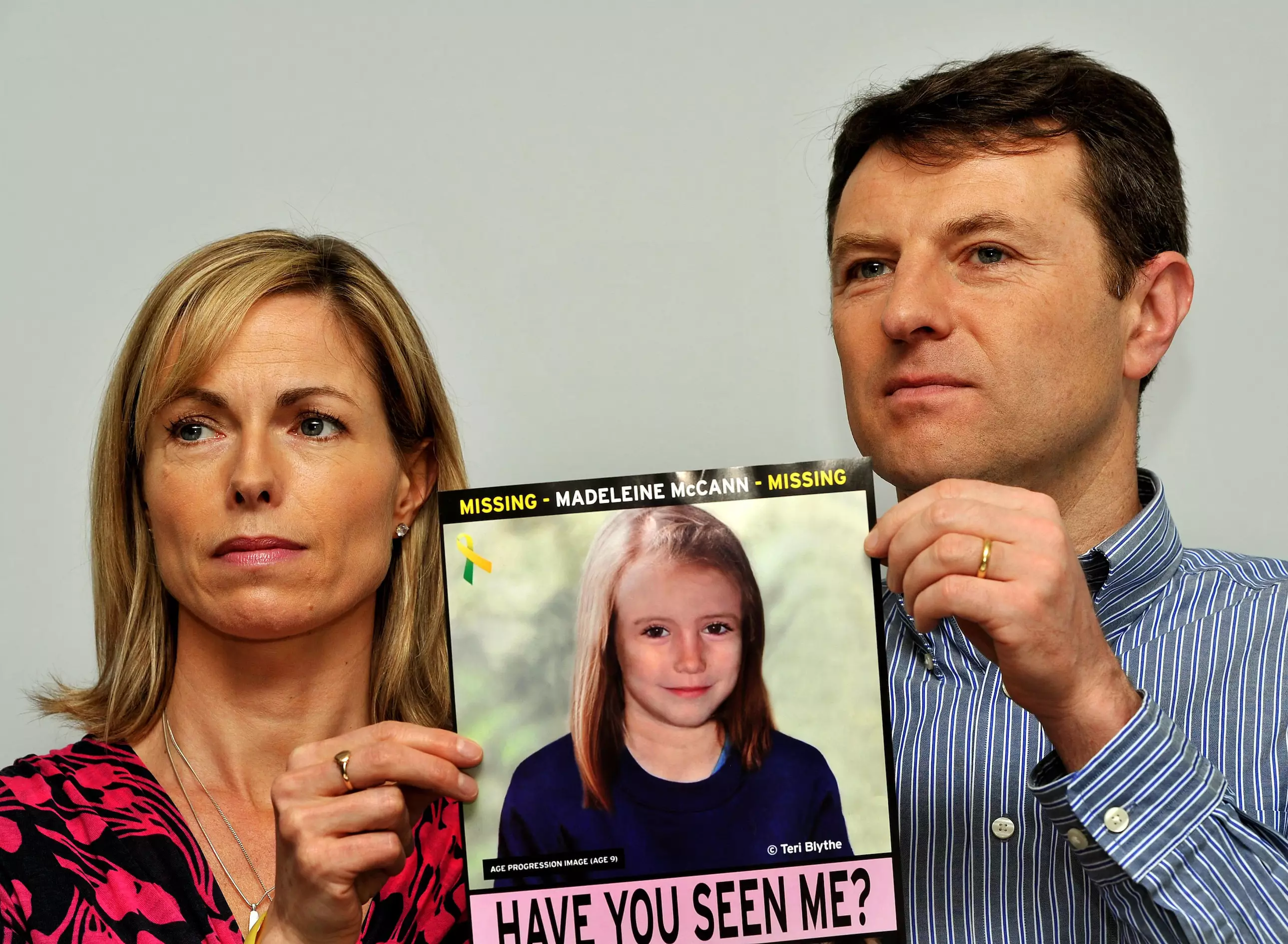 Madeleine's parents Gerry and Kate McCann holding an artist's impression of what Madeleine may have looked like aged 12 (