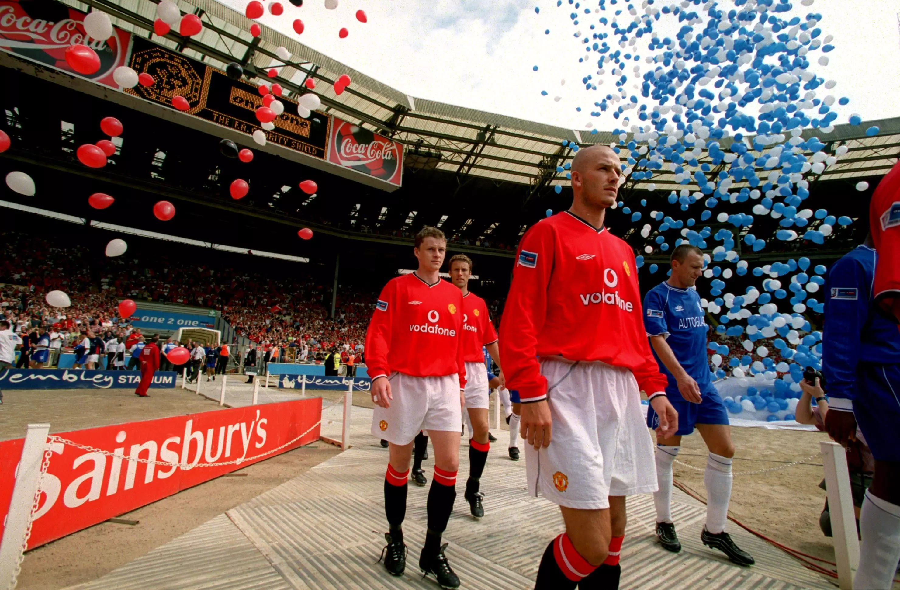 Chelsea and Manchester United players take to the field at Wemble in 2000, including David Beckham and his recently shaved head. Image credit: PA