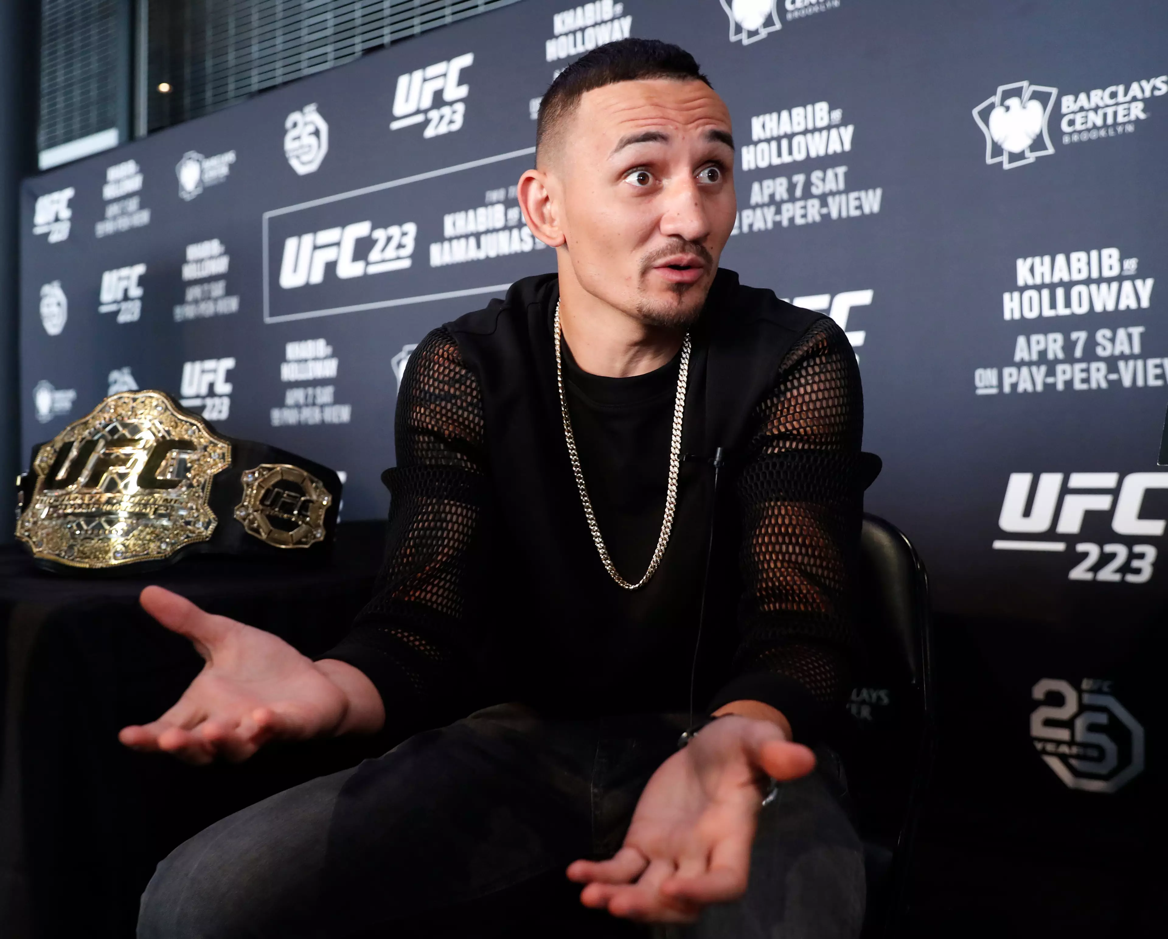 Holloway gestures during UFC media day. Image: PA