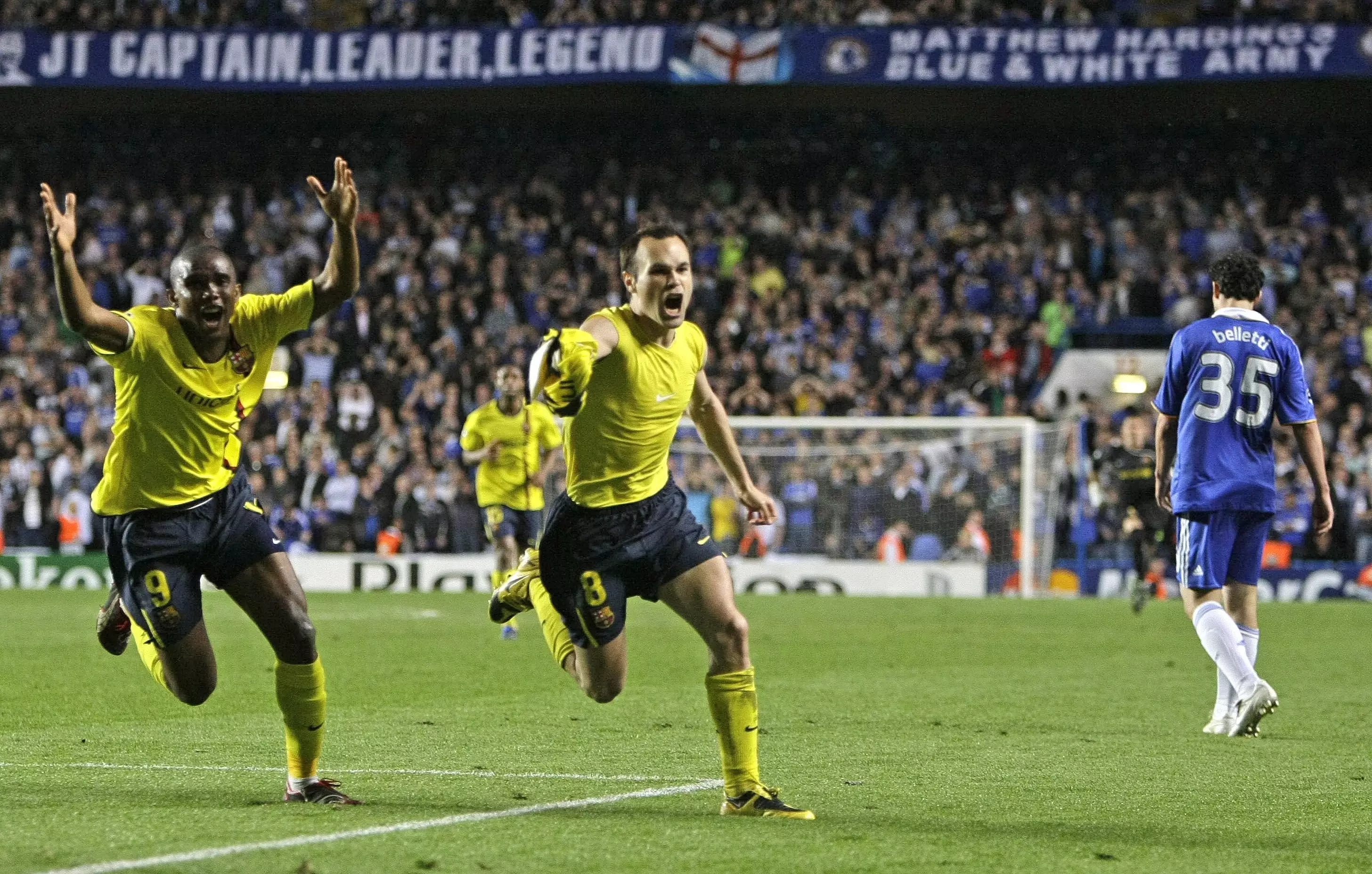 Iniesta wheels away in celebration after breaking Chelsea hearts in the last minute of stoppage time. Image: PA