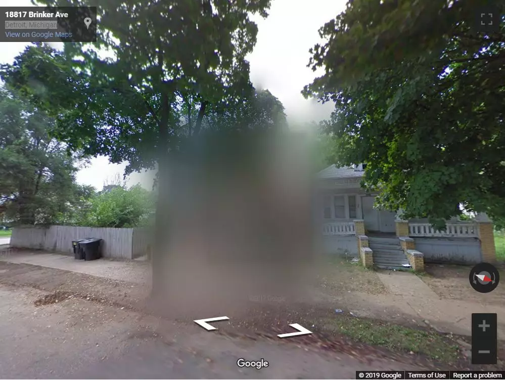 The house where the men stood is now blurred out on Street View.