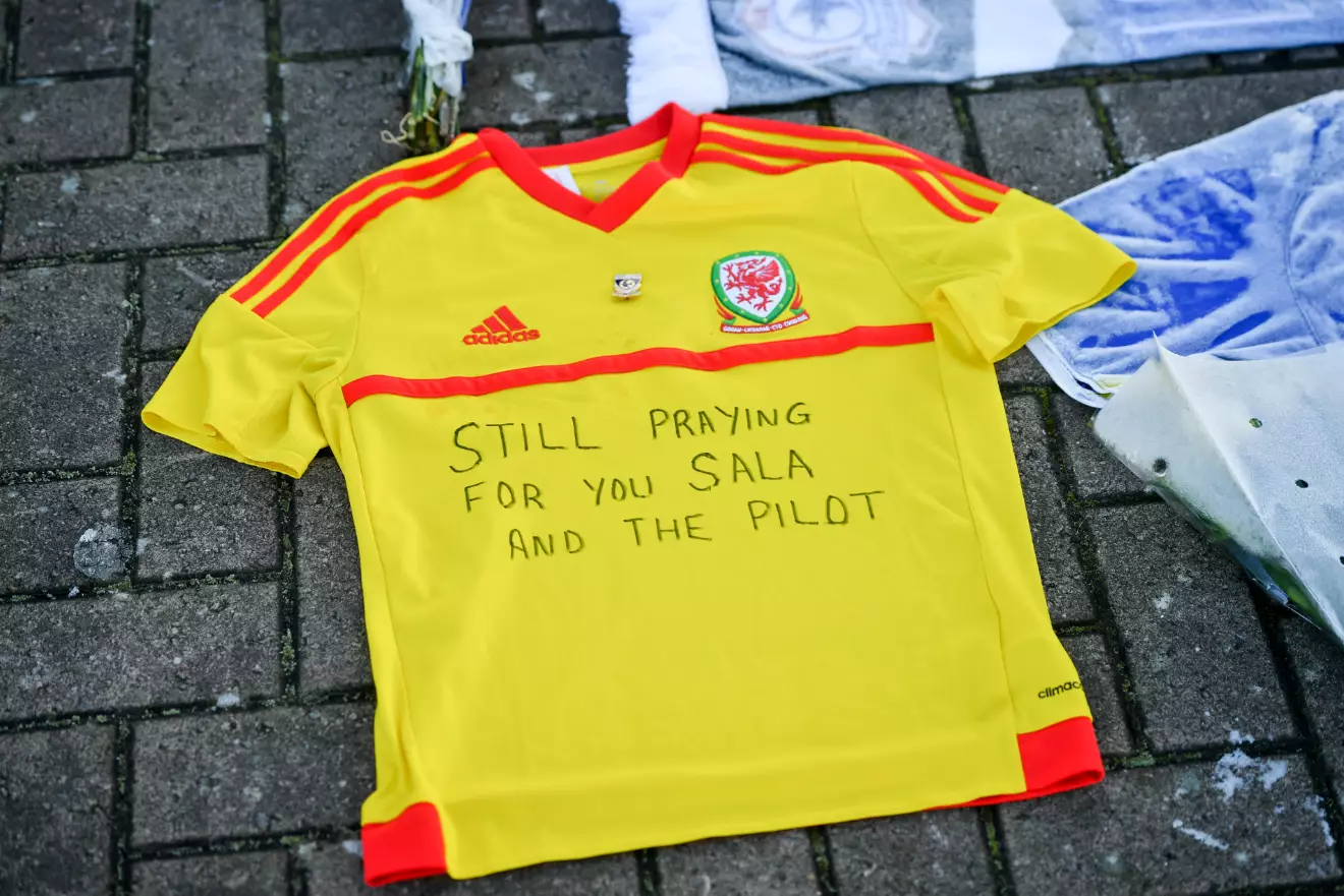 Fans have been laying tributes to the lost footballer outside the Cardiff City stadium.