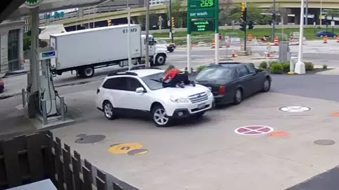 Woman Jumps On Her Car To Stop Thief From Driving Off 