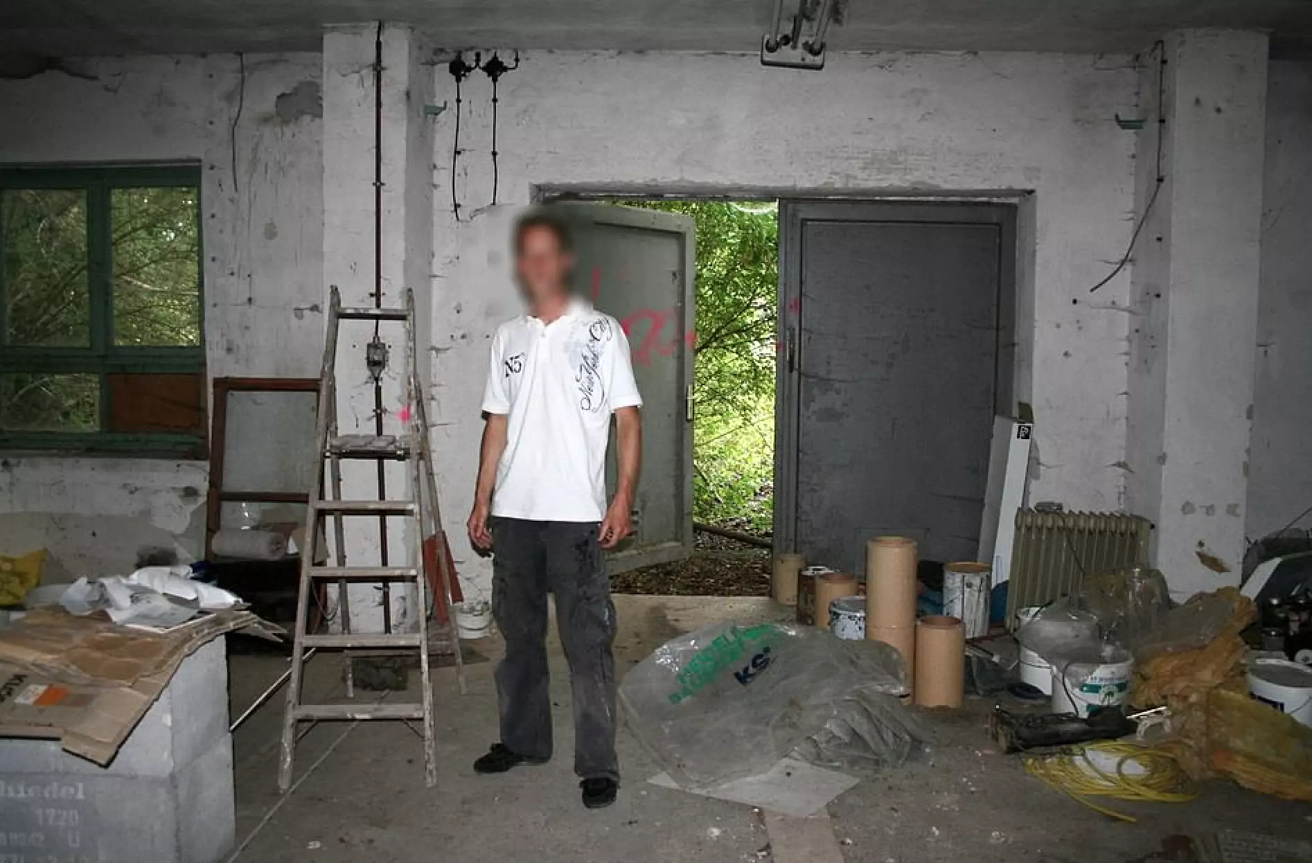 Christian B - pictured here in a disused factory where he said to have stored child porn - is currently being investigated (
