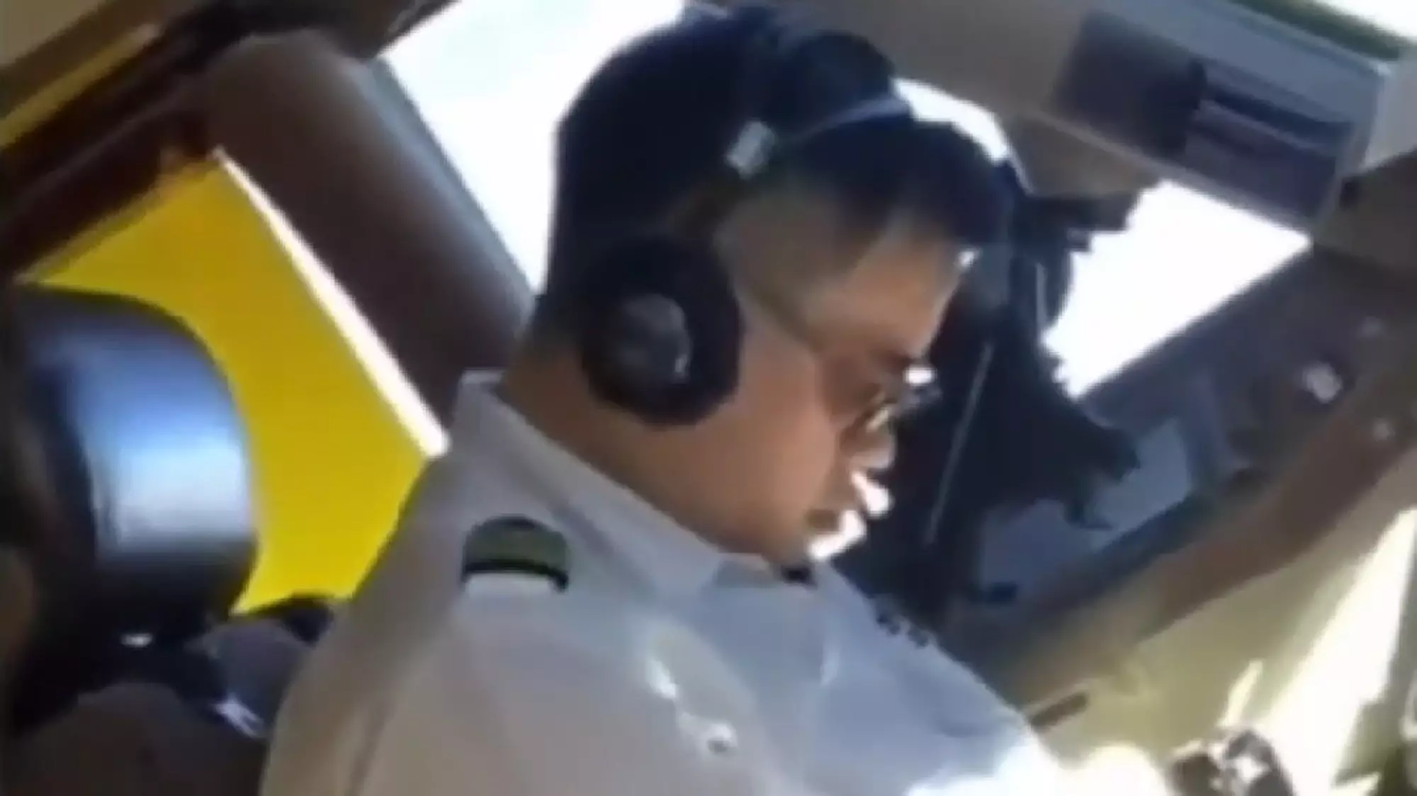 The China Airline pilot asleep in the cockpit.