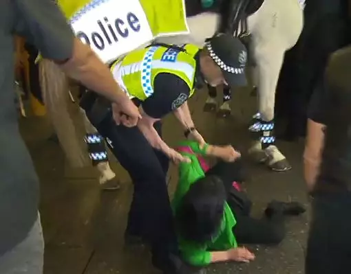 It's believed the woman hasn't been charged after hitting the police horse.