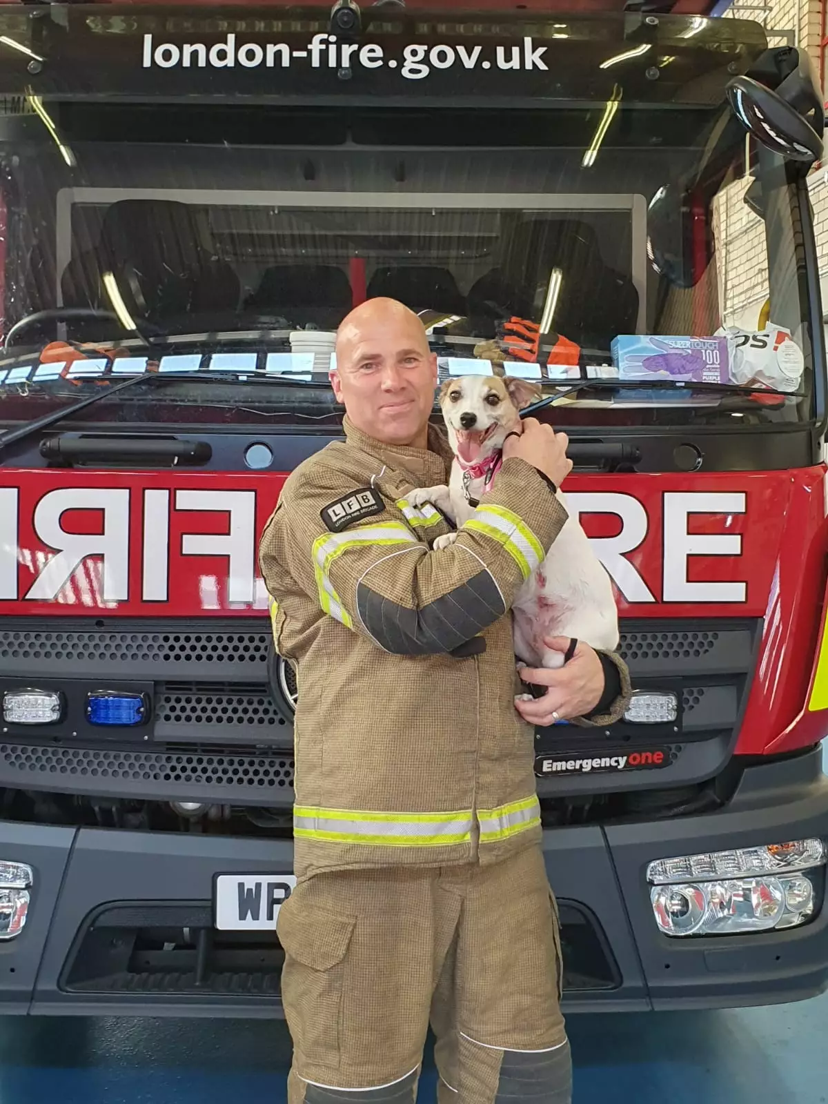 Millie now lives with firefighter Jamie and his family (