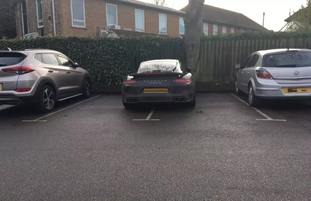 Porsche parked badly.