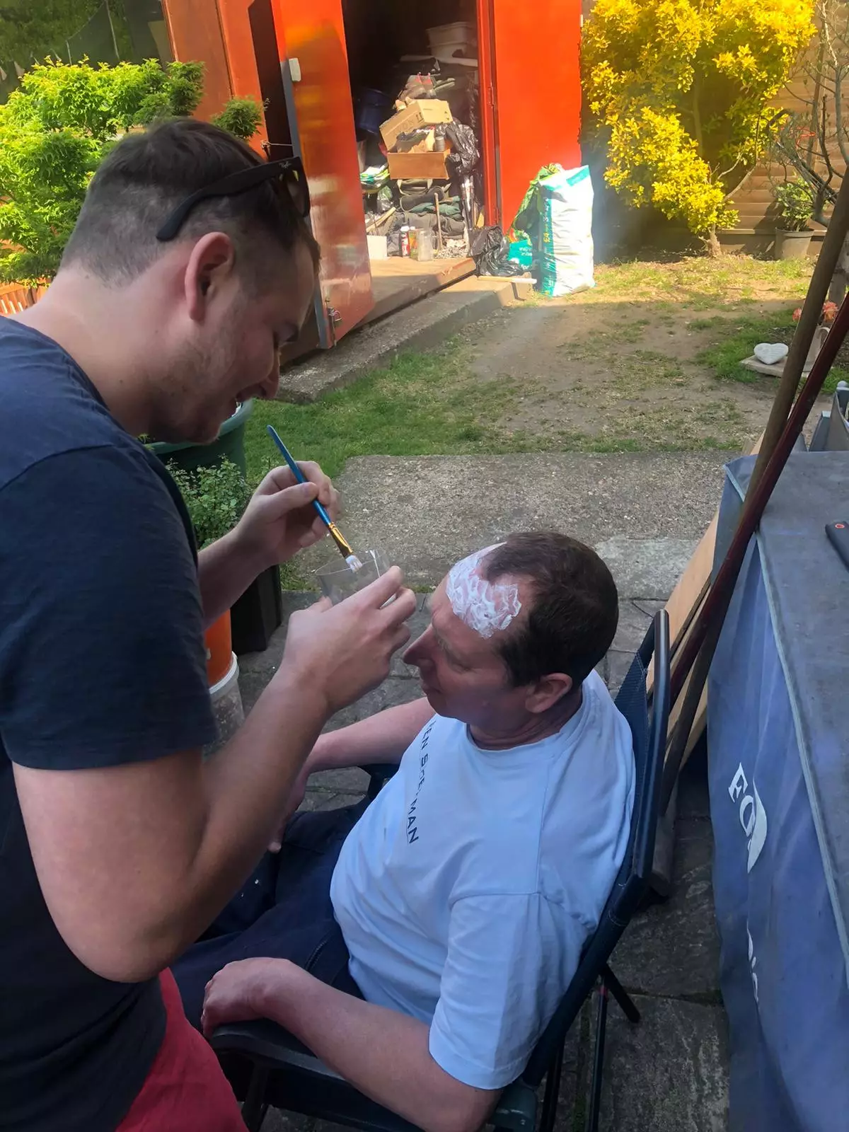 Nick used glue to stick his trimmings onto his dad's head.