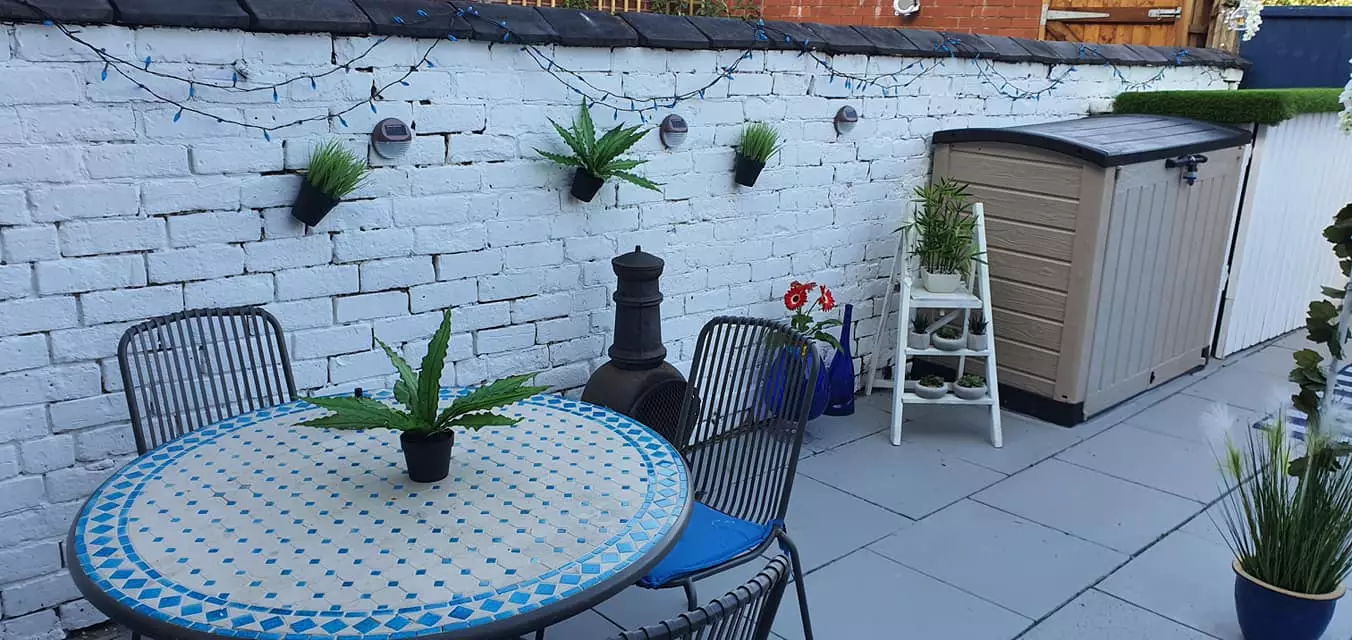 The original idea for Chris' Greek-inspired garden came from a blue and white tiled table he already owned (