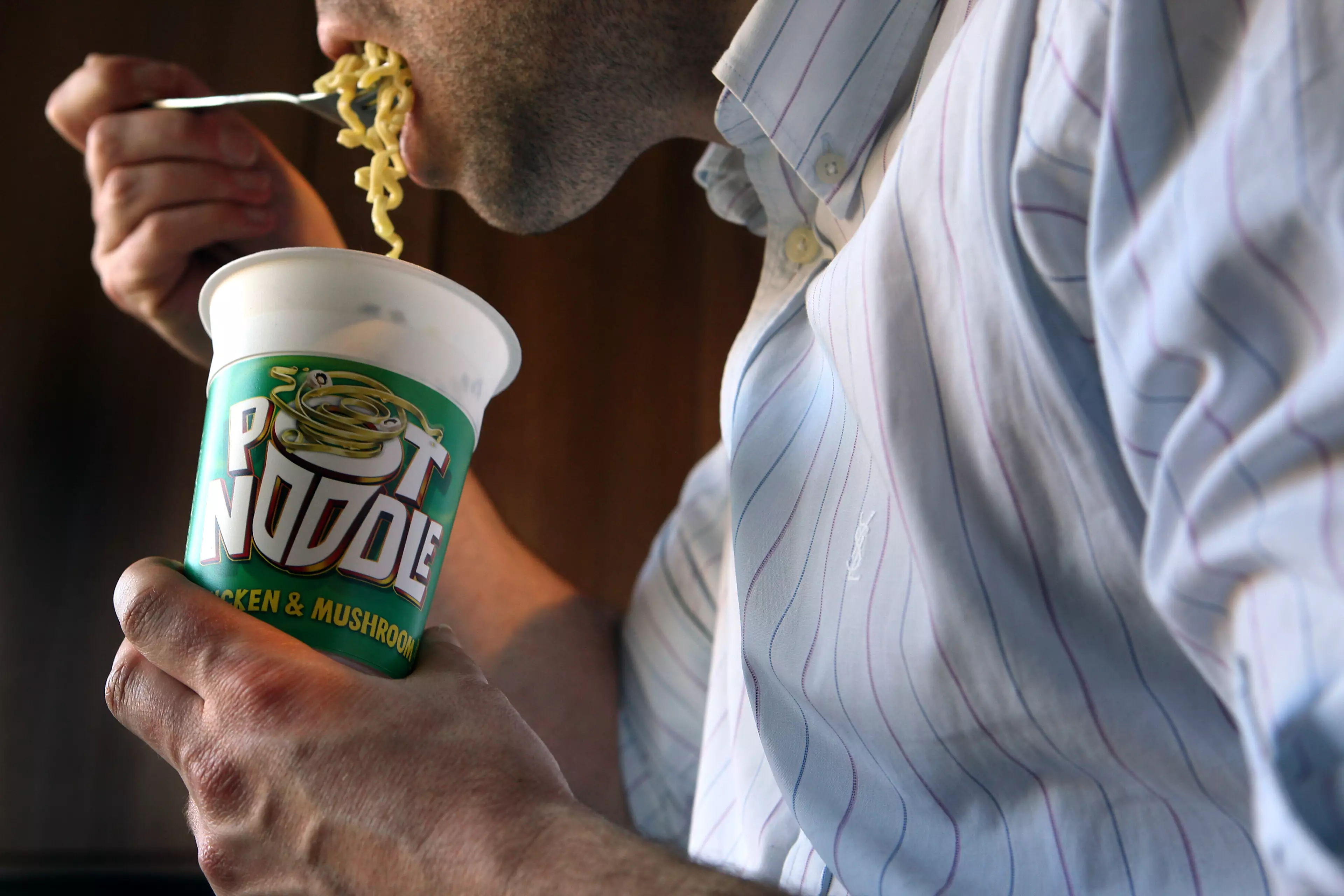 The accepted way to eat a Pot Noodle.