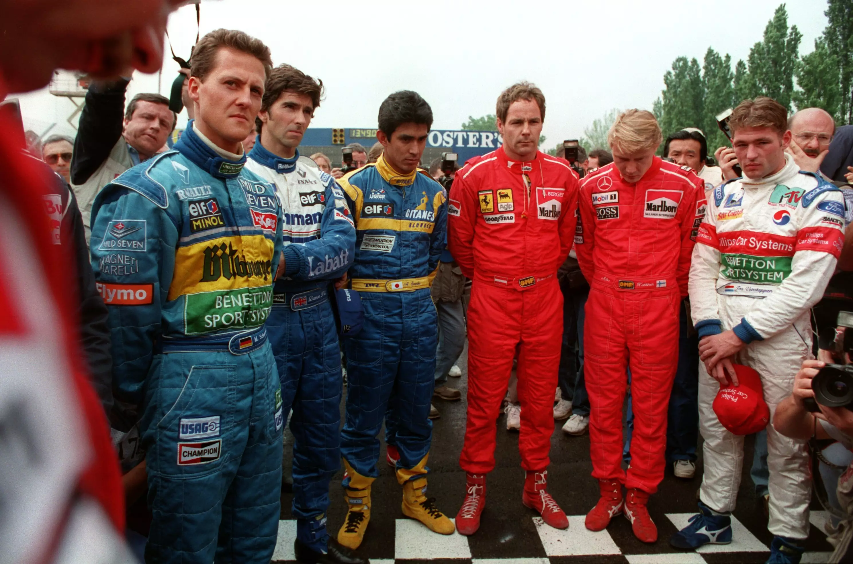 Schumacher and other racing drivers hold a minute's silence for Senna.
