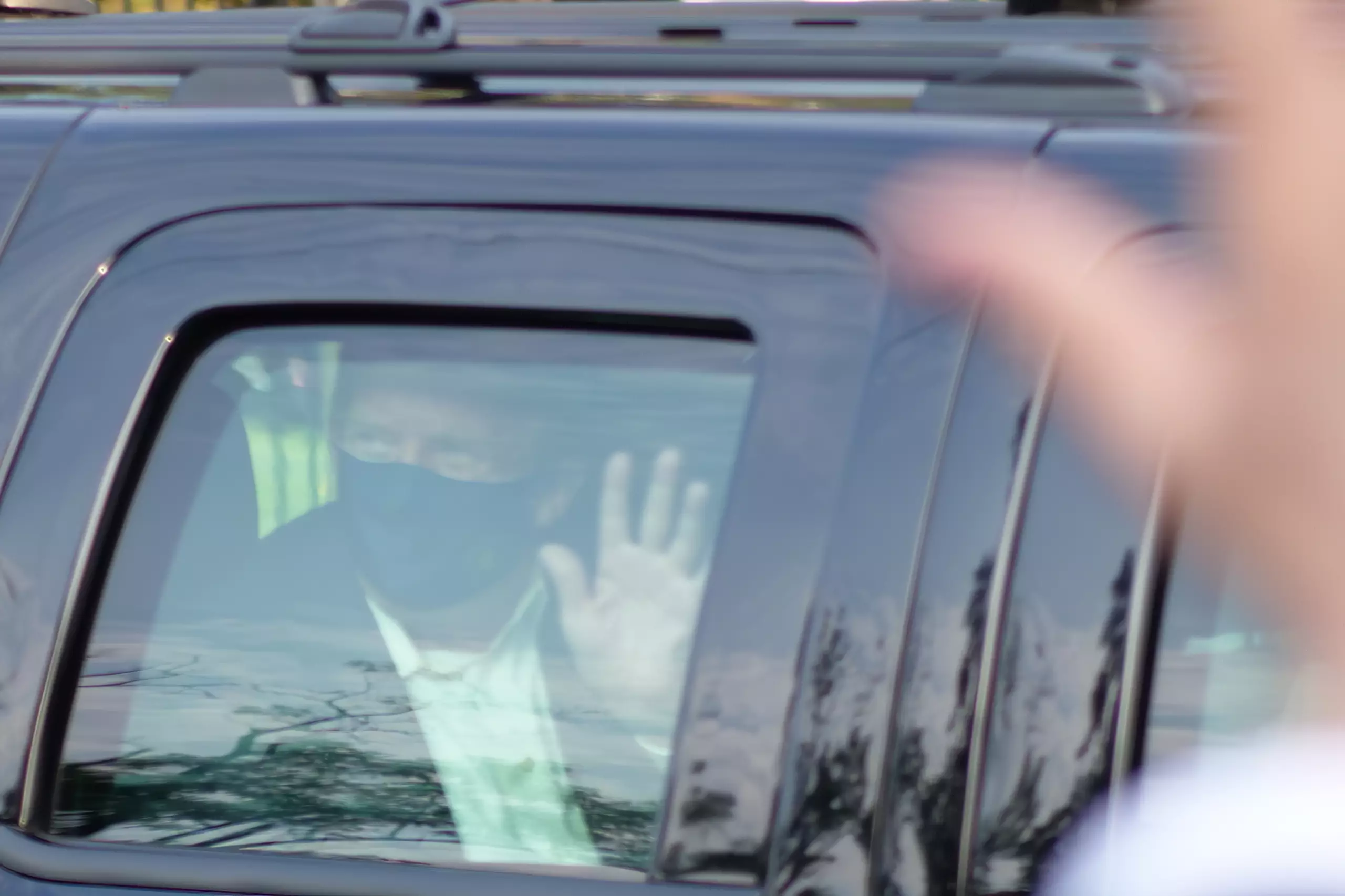 Trump left hospital briefly to wave to fans.