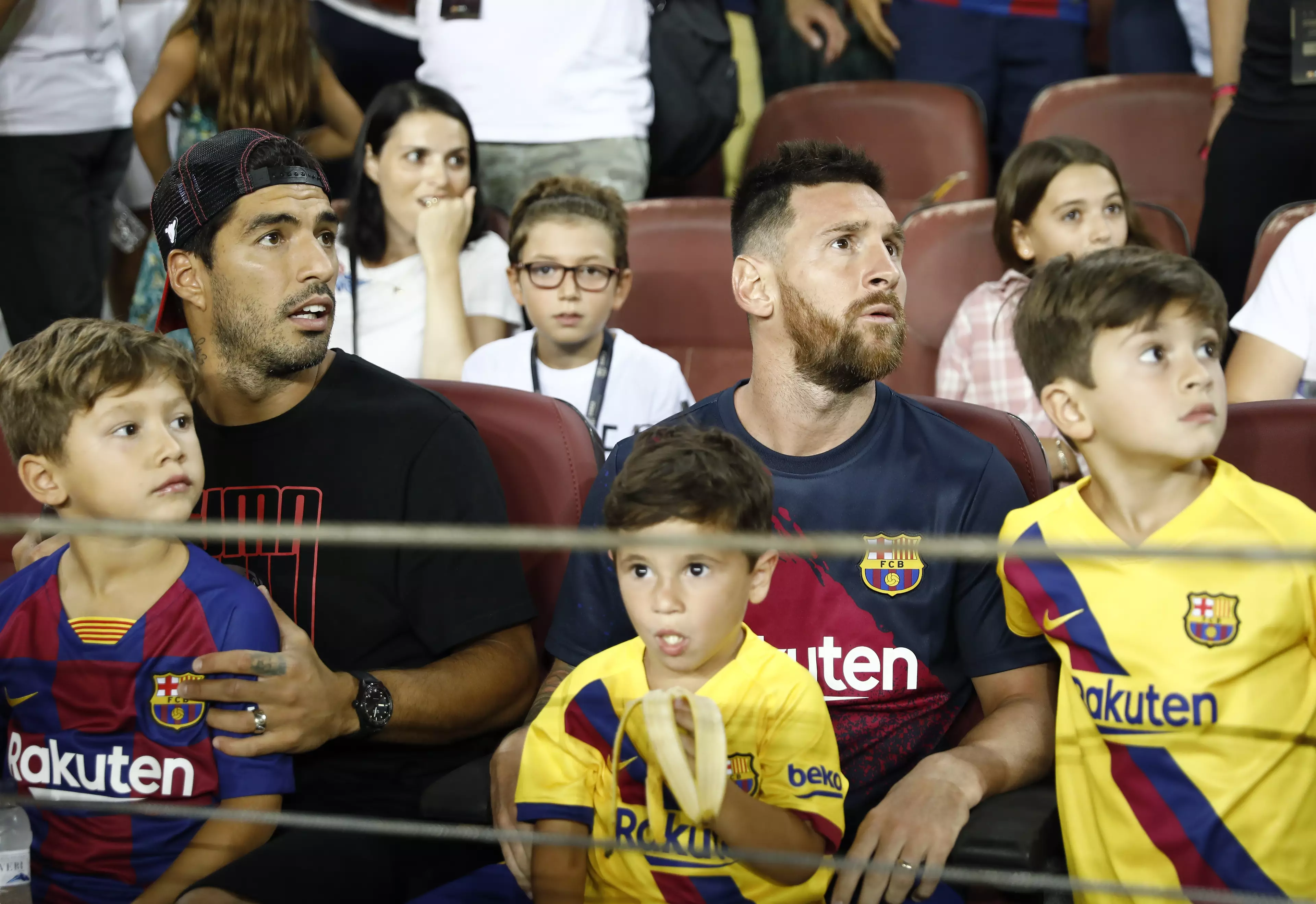 Messi sits in the stand with fellow injured Barca star Luis Suarez. Image: PA Images