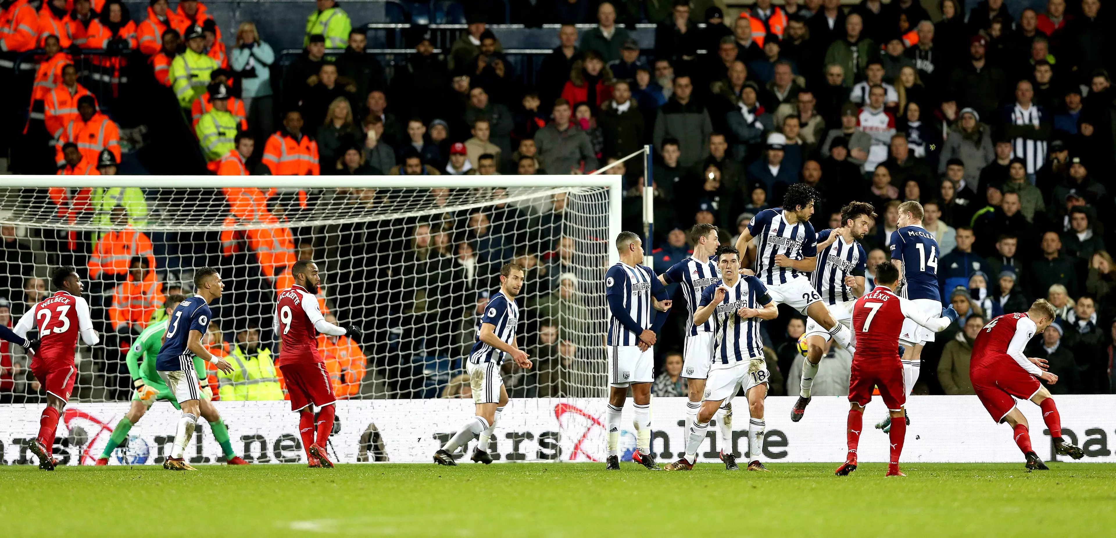 The winger turns his back on a free kick that was going wide until it hit him. Image: PA Images.
