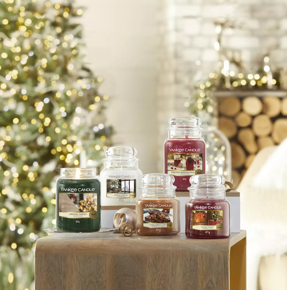 The Christmas Collection includes festive fragrances like Holiday Hearth and Singing Carols (