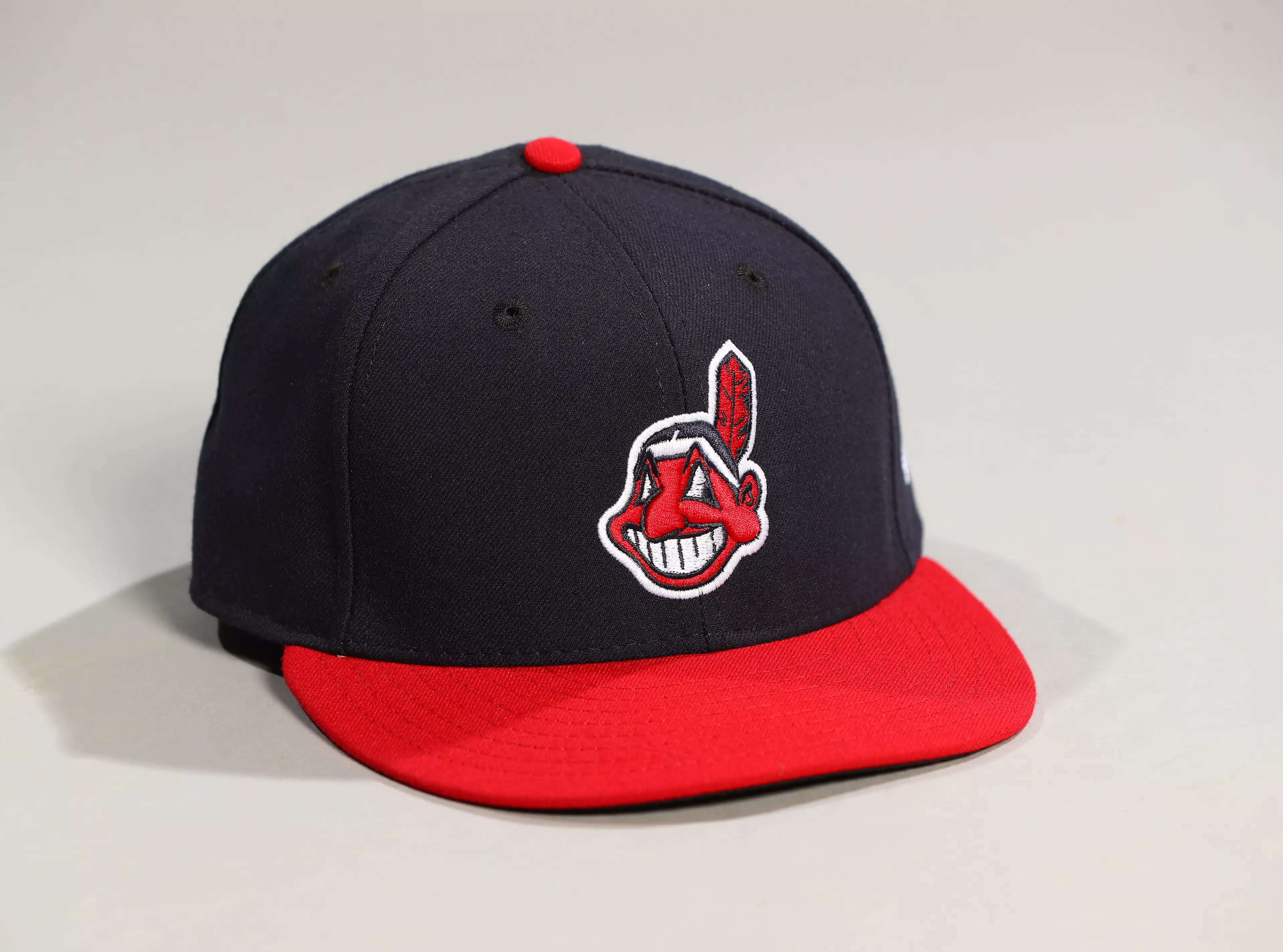 The Chief Wahoo logo on an Indians baseball cap.
