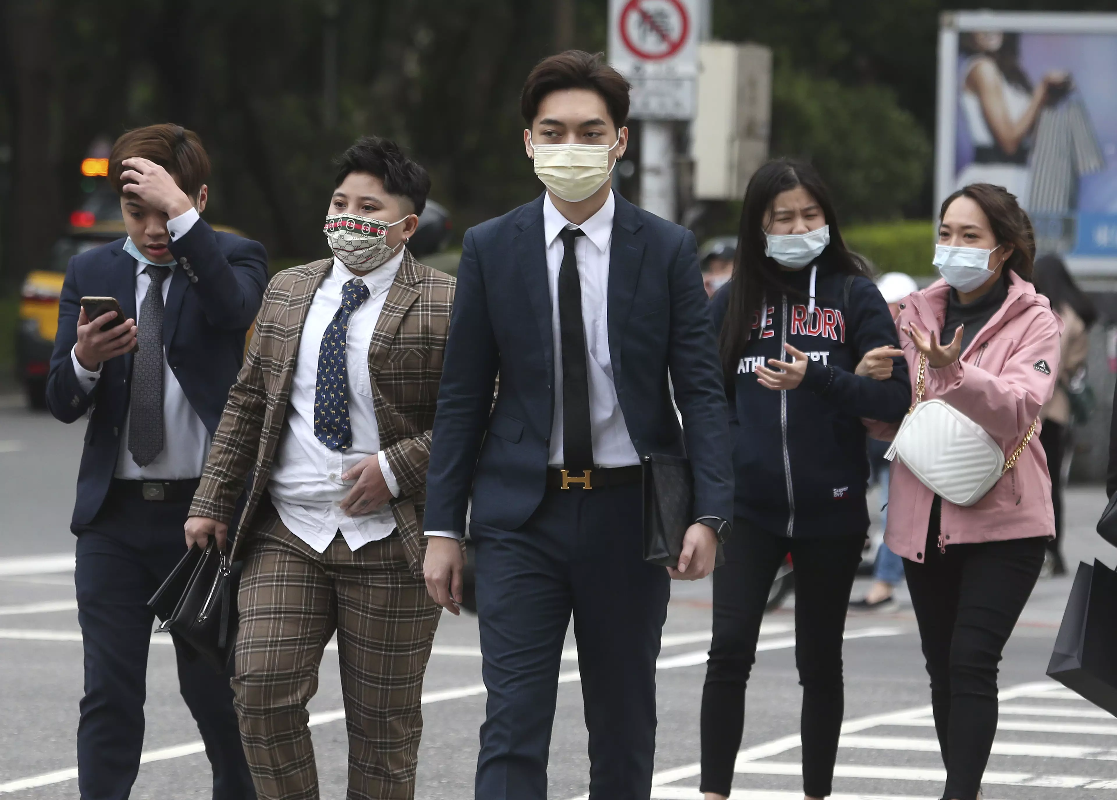 People wearing face coverings to curb the spread of Covid-19 in Taipei, Taiwan.