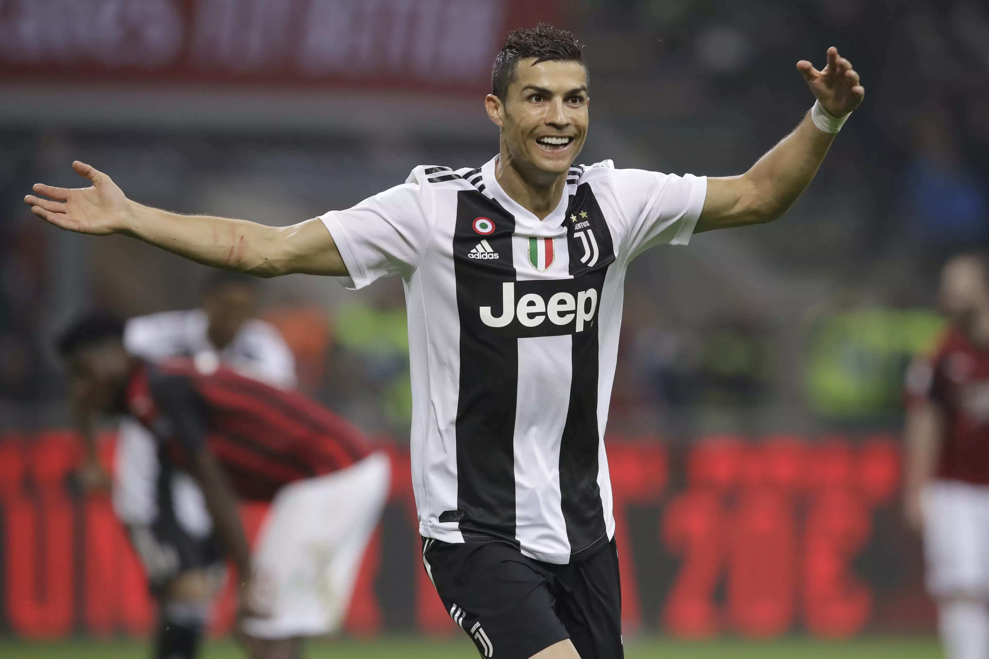 Ronaldo celebrates scoring vs. AC Milan. Image: PA