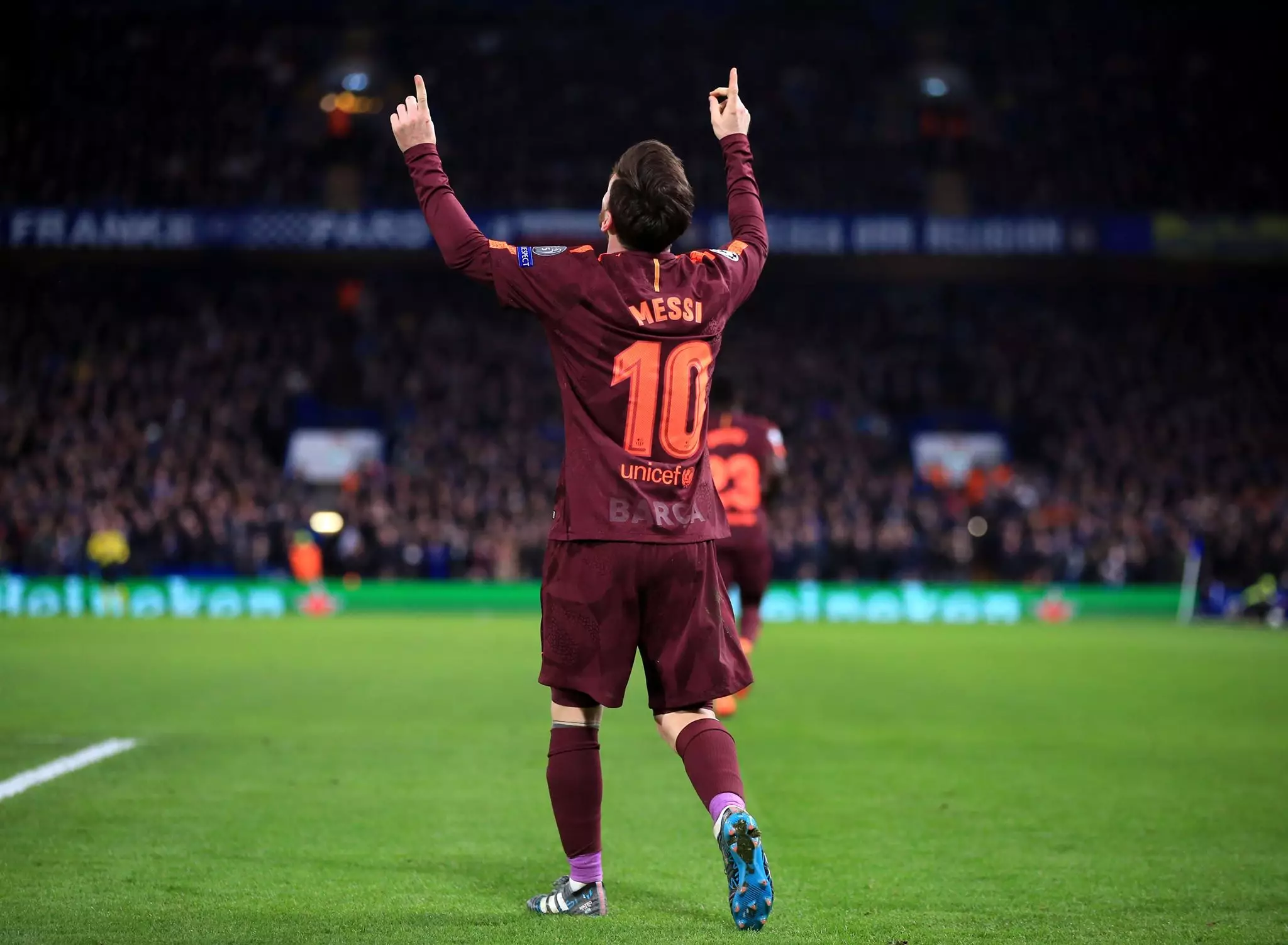 Messi celebrates scoring against Chelsea. Image: PA