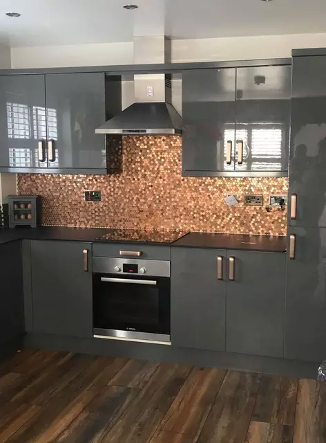 Emma's unique kitchen wall feature is made entirely out of old and new pennies (