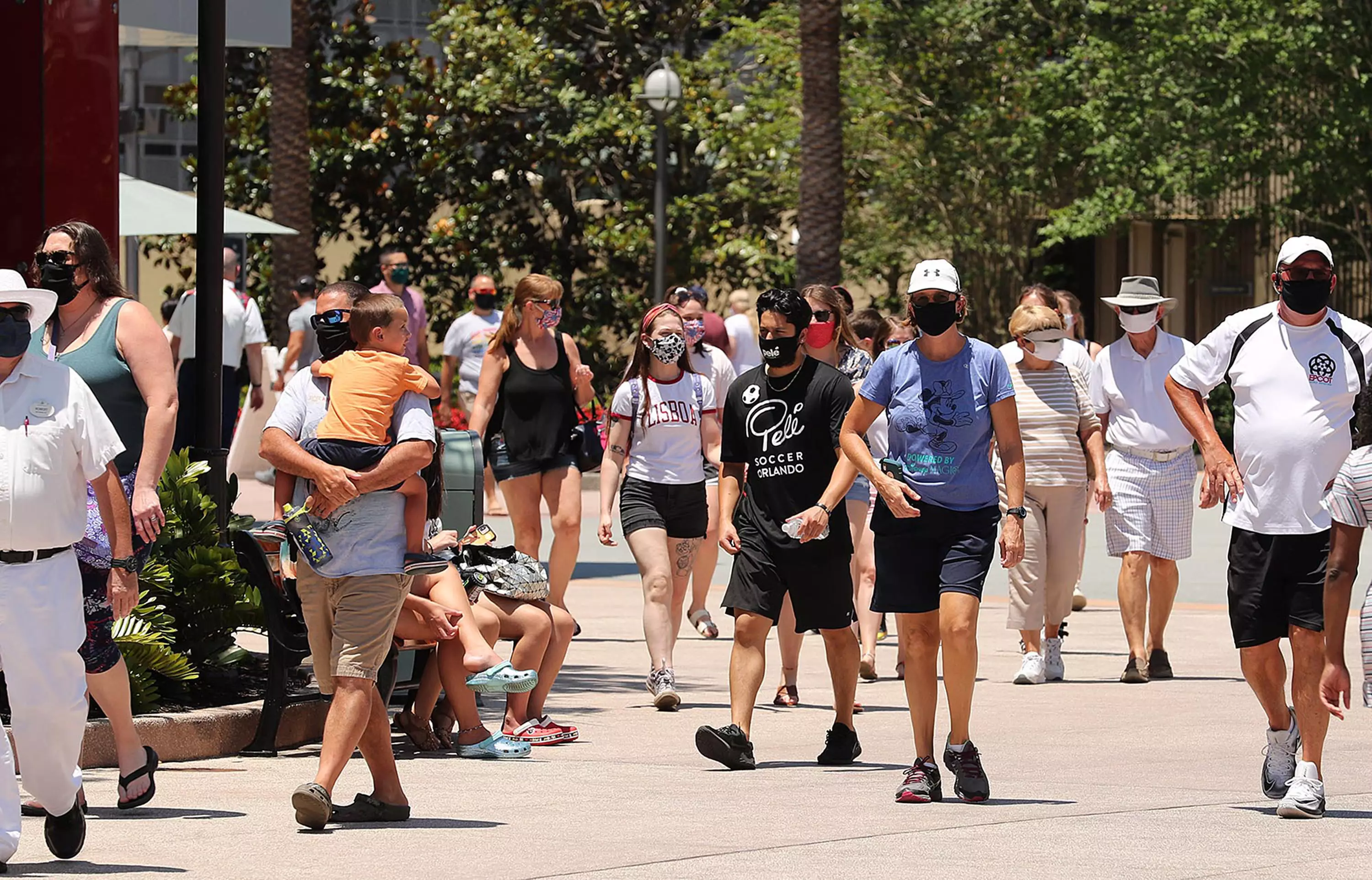 Guests stroll at Disney Springs in Orlando.