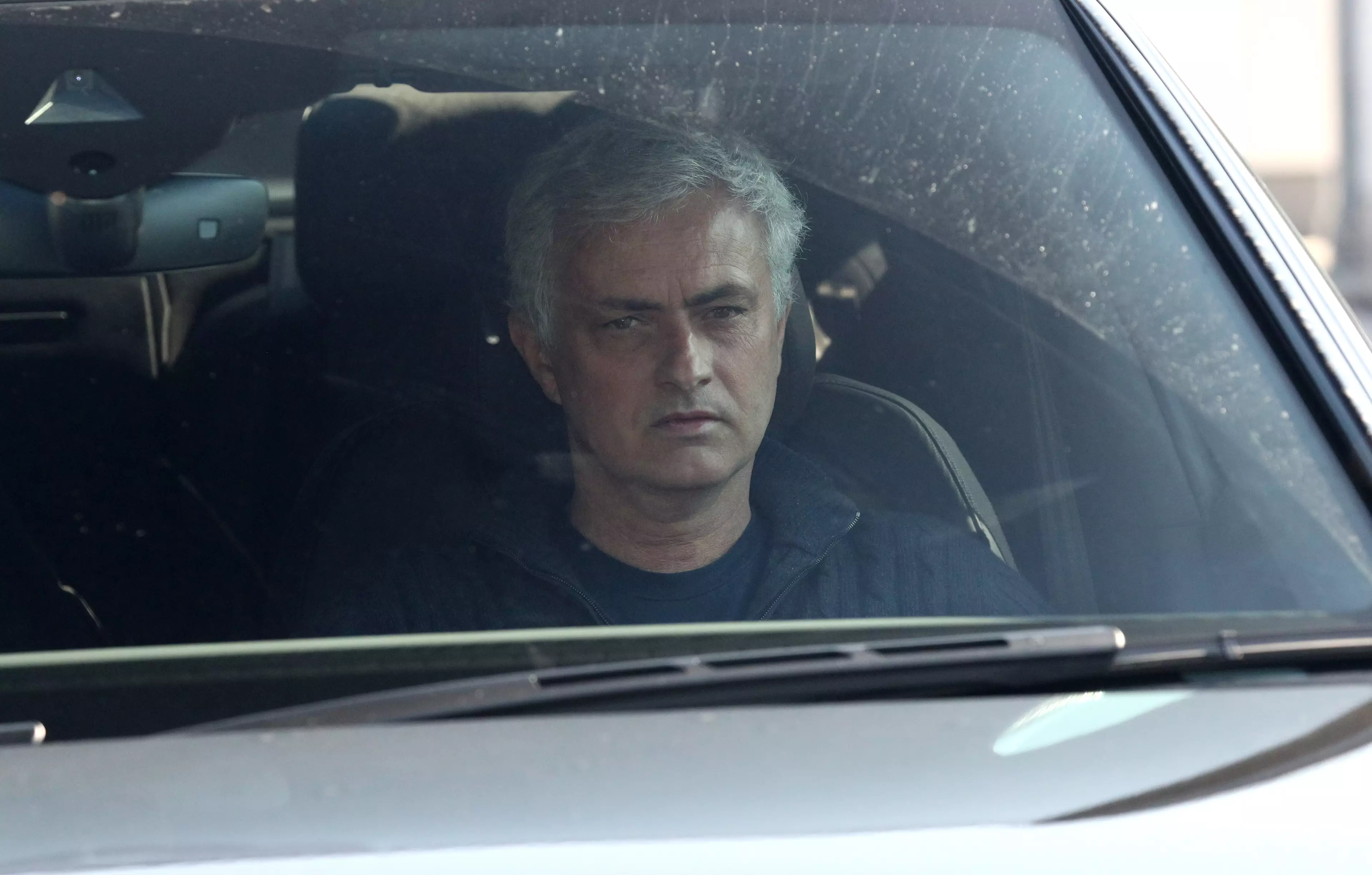 Mourinho driving away from the training ground, no doubt tired after 4 hours having a go at his former players. Image: PA Images