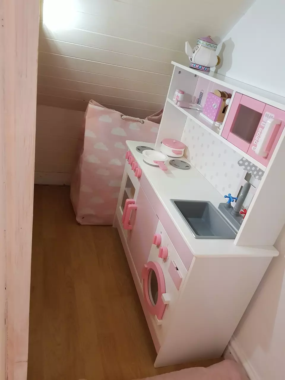 The under stairs play area comes complete with kitchen. (