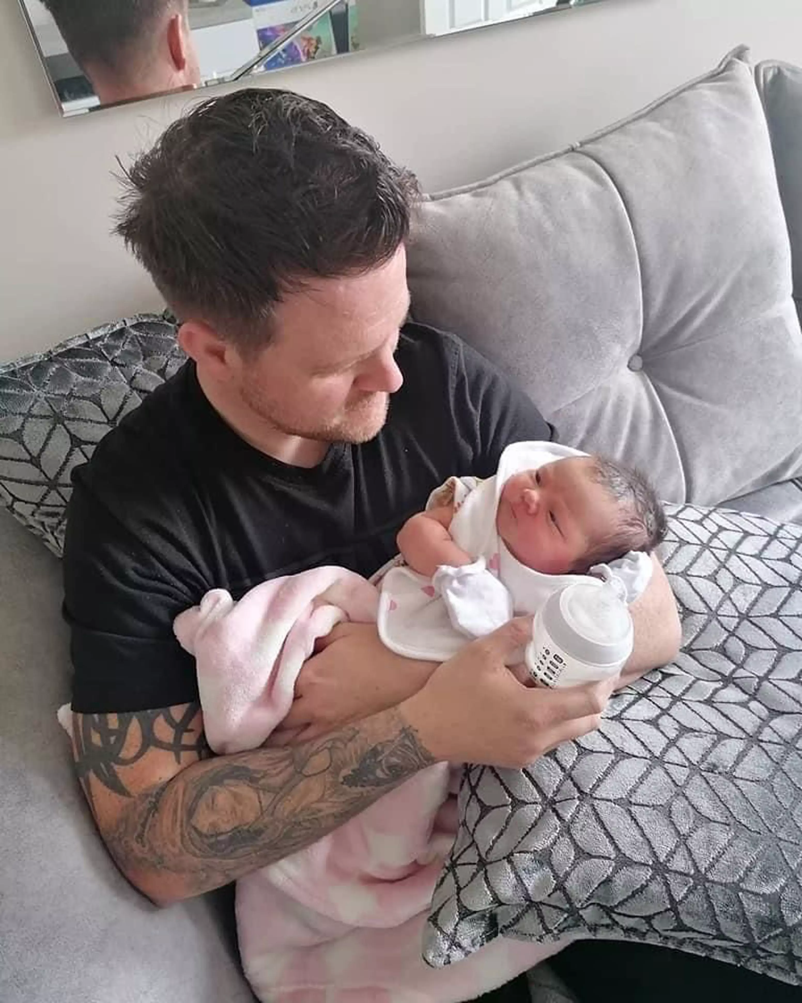 Richard, 35, pictured holding his granddaughter (