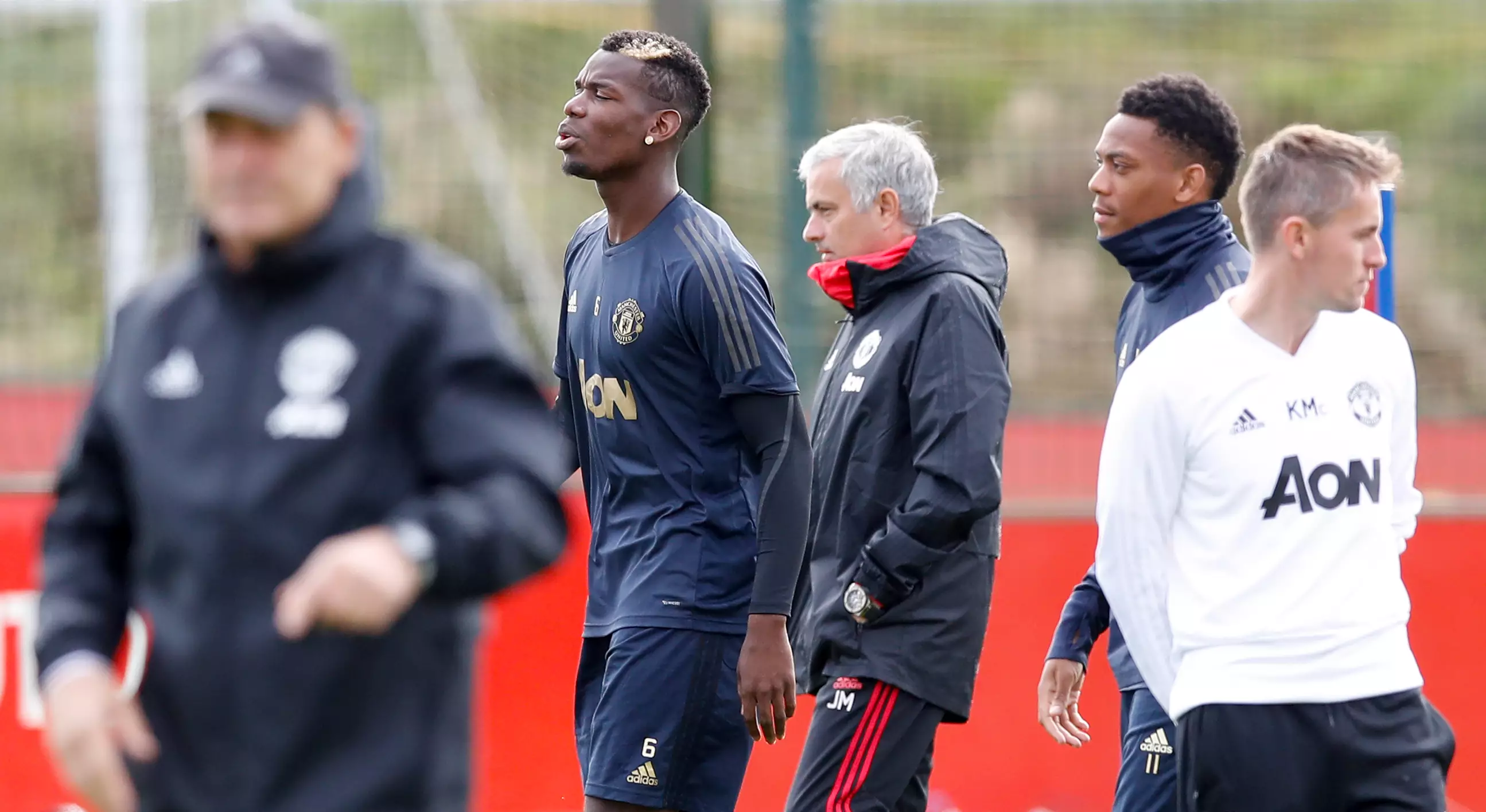 Paul Pogba and Jose Mourinho in training. Image: PA